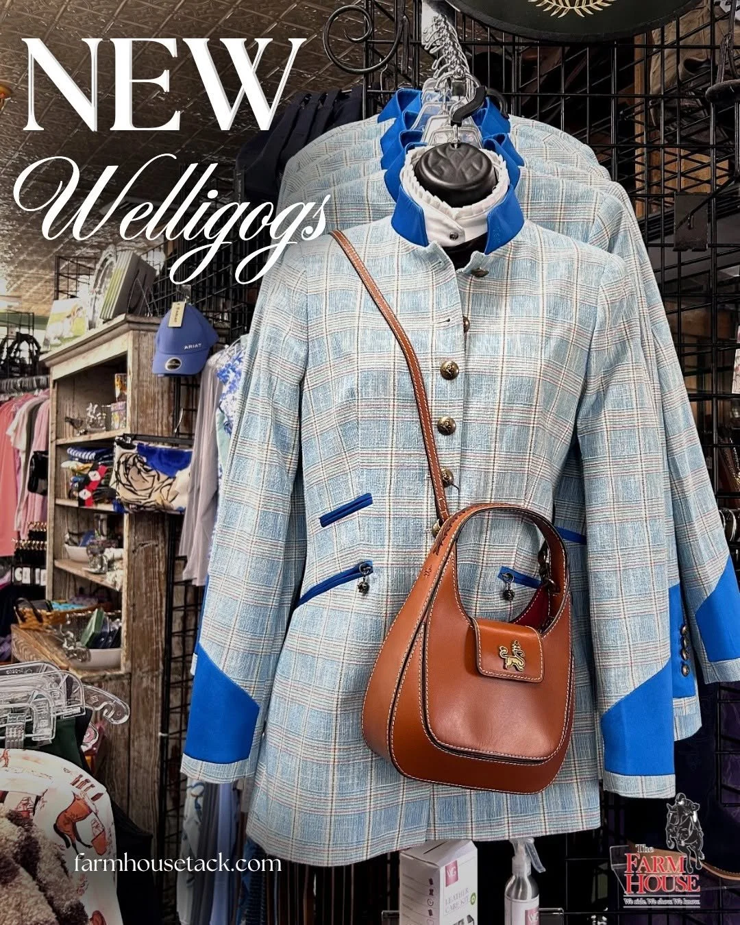 A plaid blue and grey coat with blue accents on a mannequin, with a brown crossbody purse hanging over it, displayed in a retail store. The background shows shelves with accessories and clothing.
