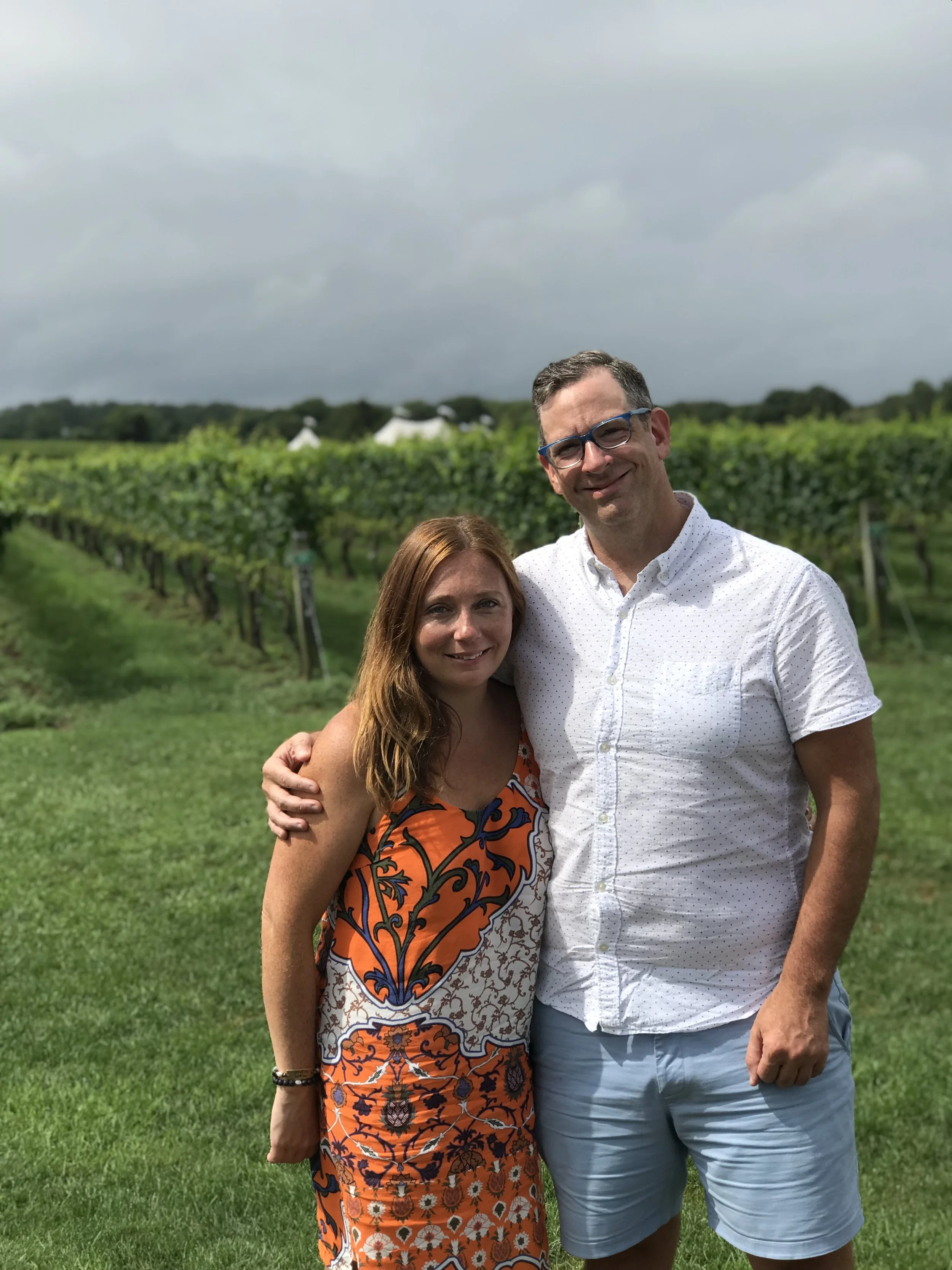 Jesse and Katie, founders of Cape Azur, standing together outdoors.