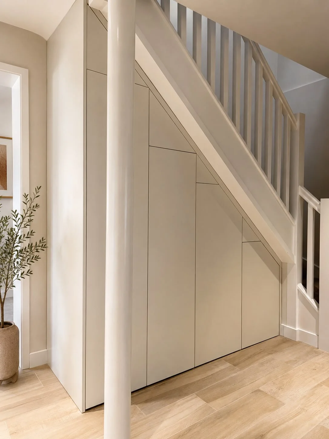Bespoke storage designed to make the most of the space beneath the stairs, finished with clean lines for a seamless look.

Designed &amp; built in Surrey.

#BespokeJoinery #BespokeFurniture #UnderStairsStorage #Carpentry #SurreyJoinery