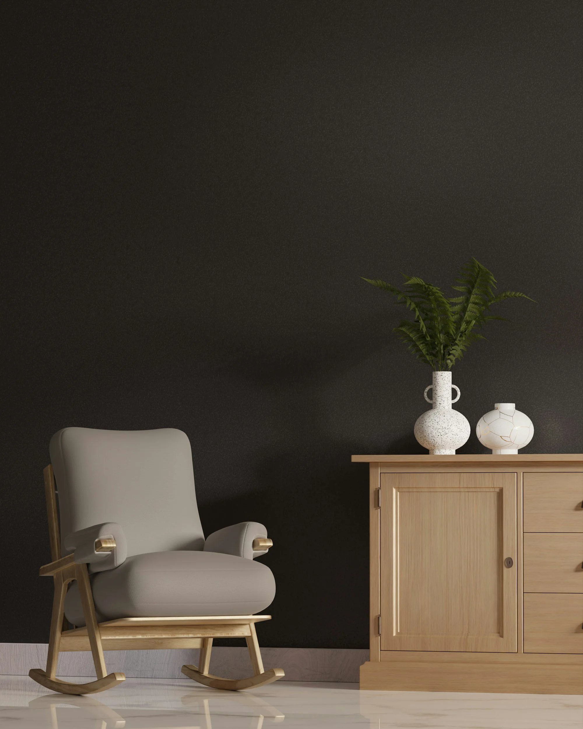 A white armchair with wooden armrests and legs, a light wood cabinet with a sliding door, and two decorative vases with plants on top, set against a dark wall.