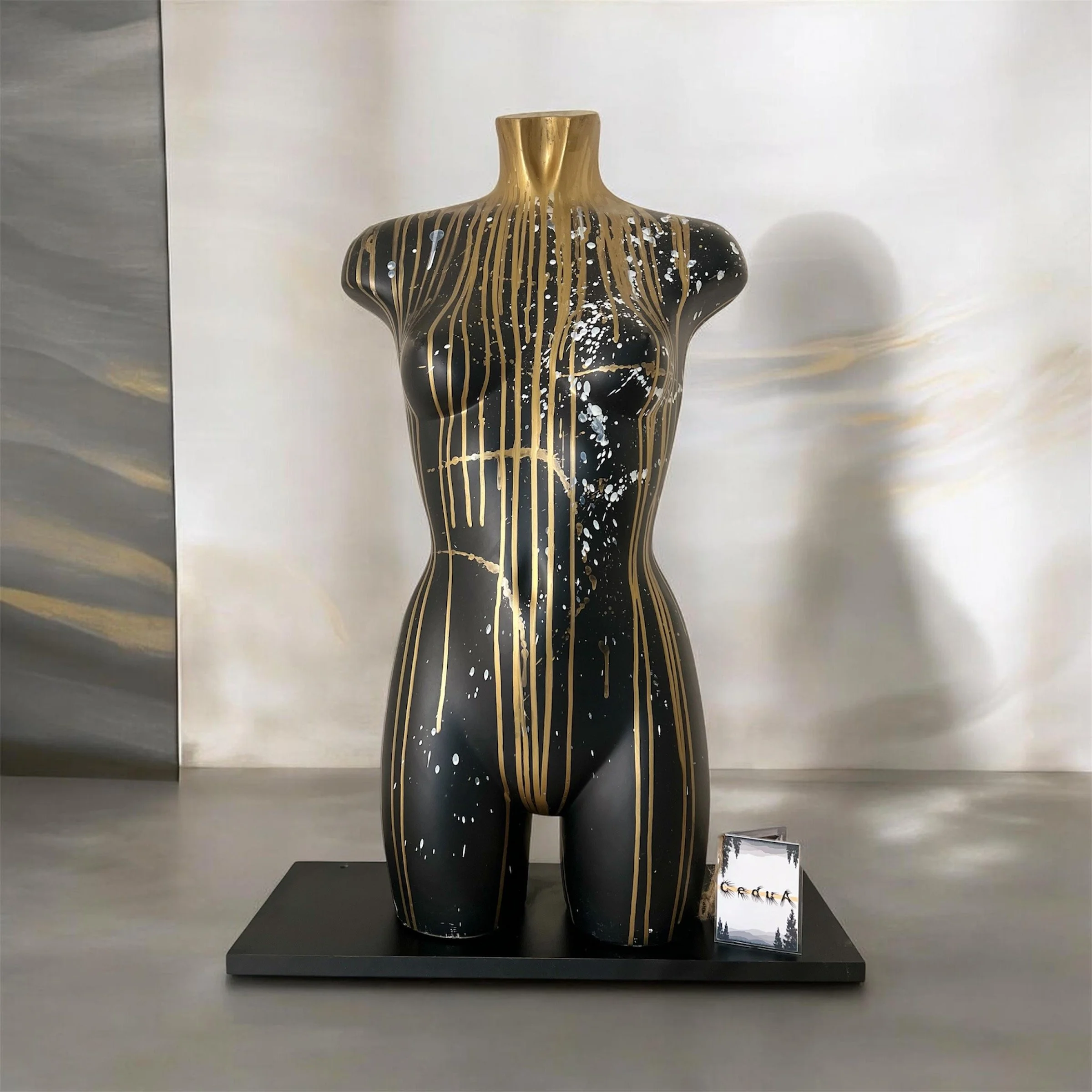 Display mannequin torso for a clothing store, hand decorated whith an abstract design