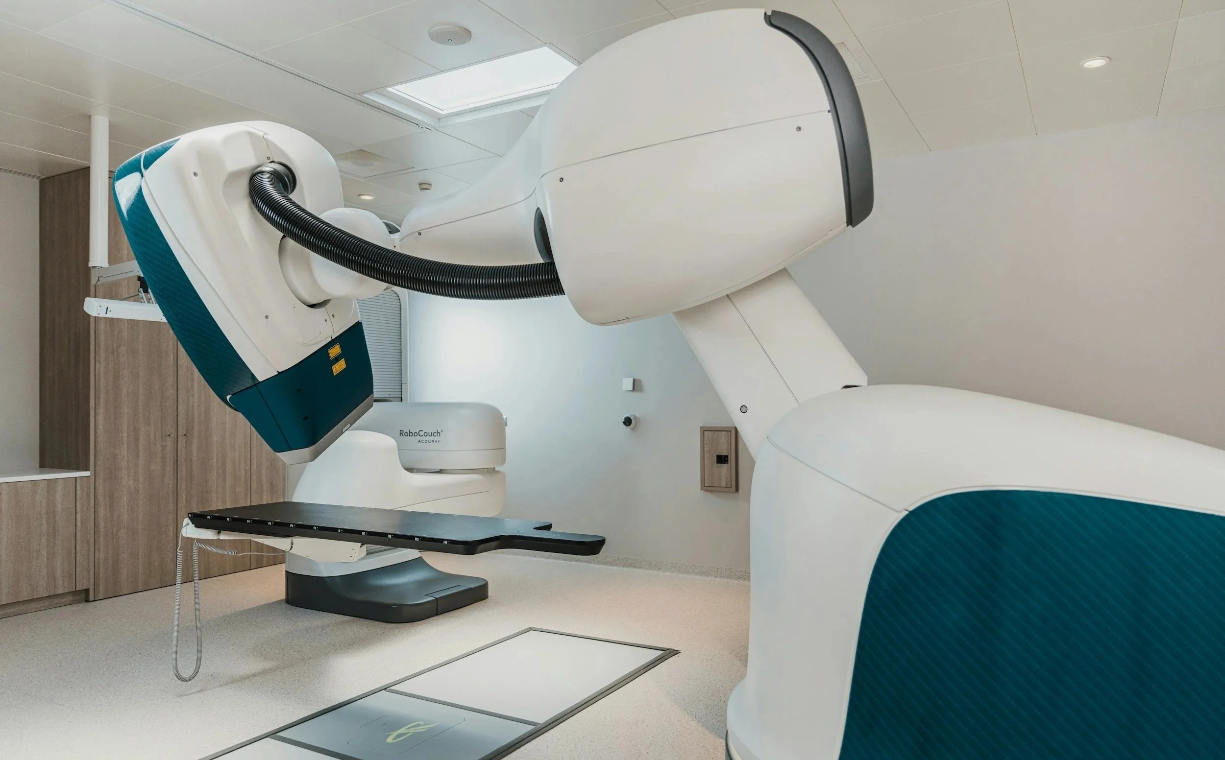 Radiation therapy machine in a hospital treatment room