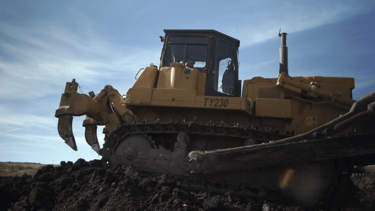 Bulldozer pushing dirt on construction site