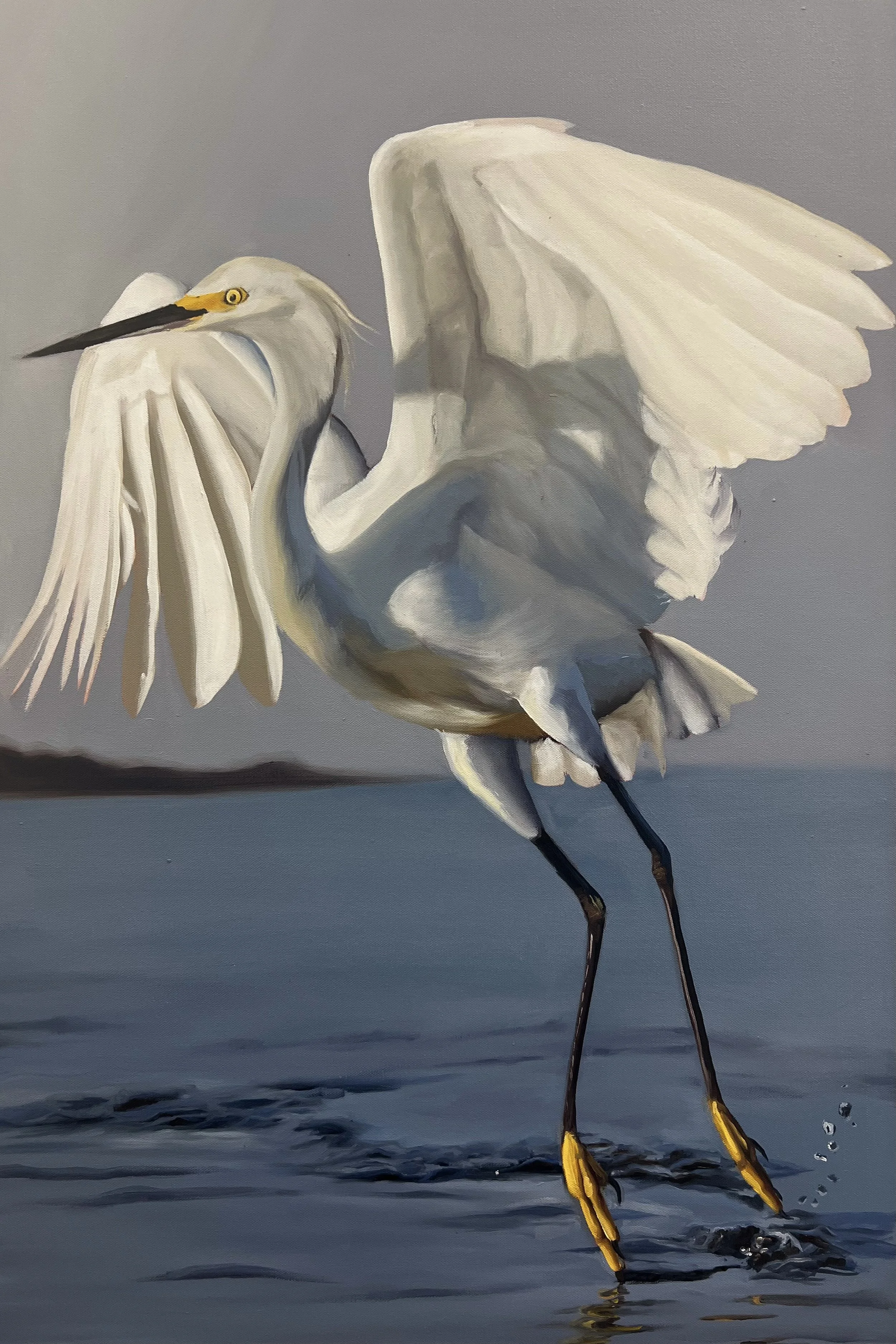 Painting of a great egret standing in water, with its wings partially extended. The egret has a long, black beak, yellow feet, and a yellow patch around its eyes. The background is a calm, bluish-gray water surface.