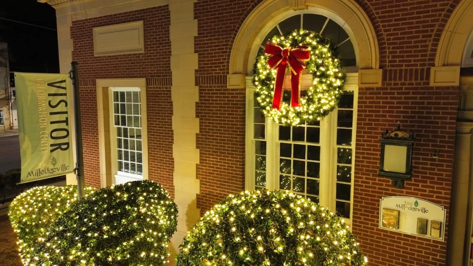 High-visibility commercial property holiday lighting display for a retail plaza in Milledgeville, GA.