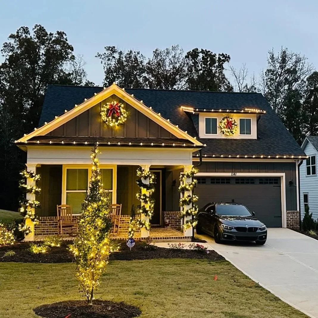 Custom C9 commercial LED roofline holiday lighting installation on a brick home in Macon, GA.