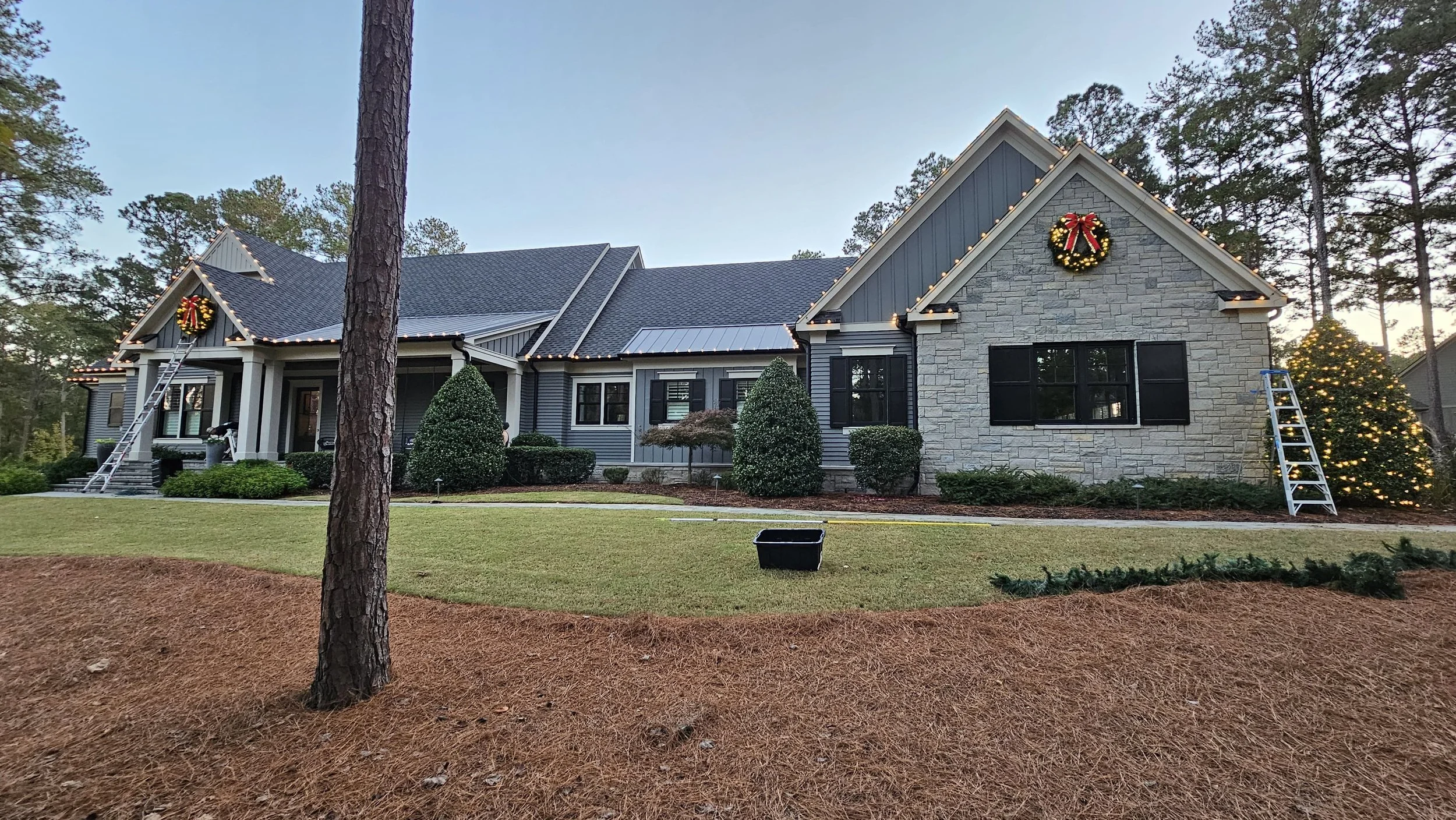 Beautiful residential Christmas light installation with C9 LEDs and wreaths in Oconee County, GA.