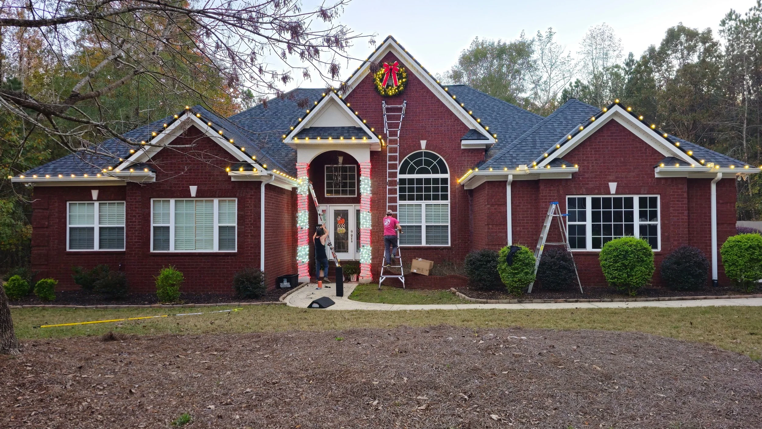 Professionally installed Christmas wreaths and C9 roofline lights in Milledgeville, Georgia.