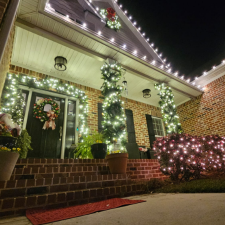 Professional residential Christmas light installation featuring warm white LEDs in historic Macon, Georgia.