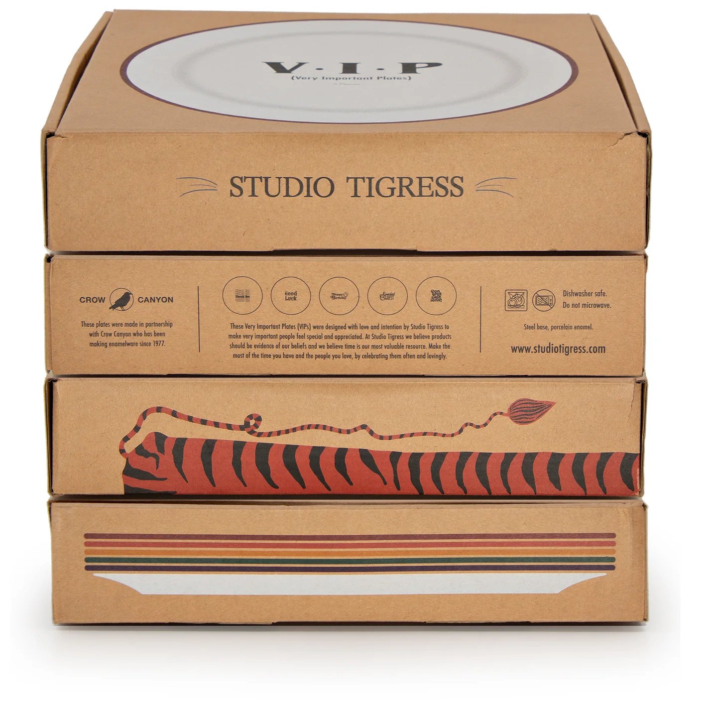 Stacked cardboard boxes with printed text and illustrations, including the words 'V.I.P (Very Important Plates)', 'Studio Tigress', and a stylized tiger illustration on the bottom box.