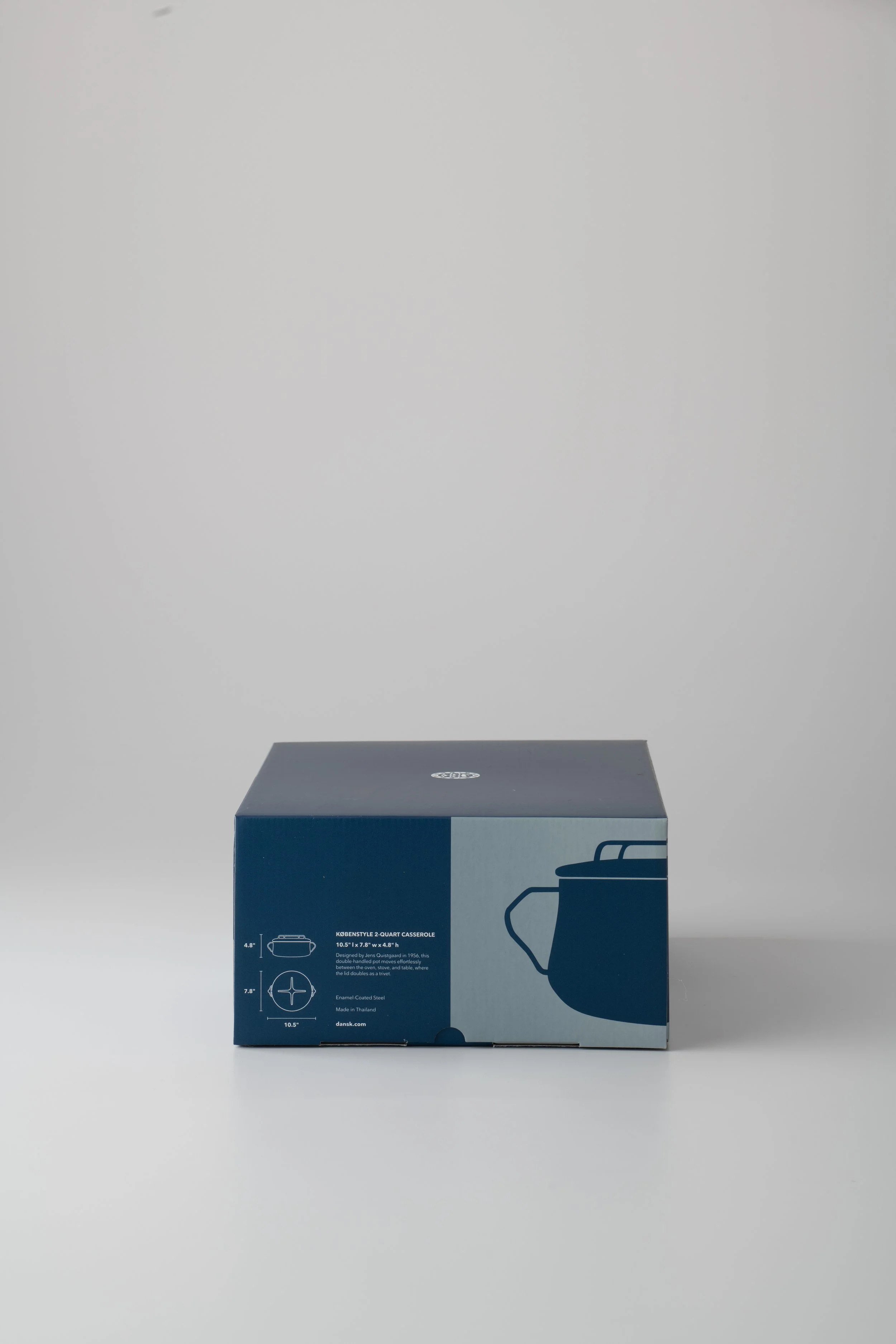 A blue box labeled 'Koenstyle 2-Quart Casserole' with a picture of a casserole dish on it, sitting on a plain gray surface with a gray background.