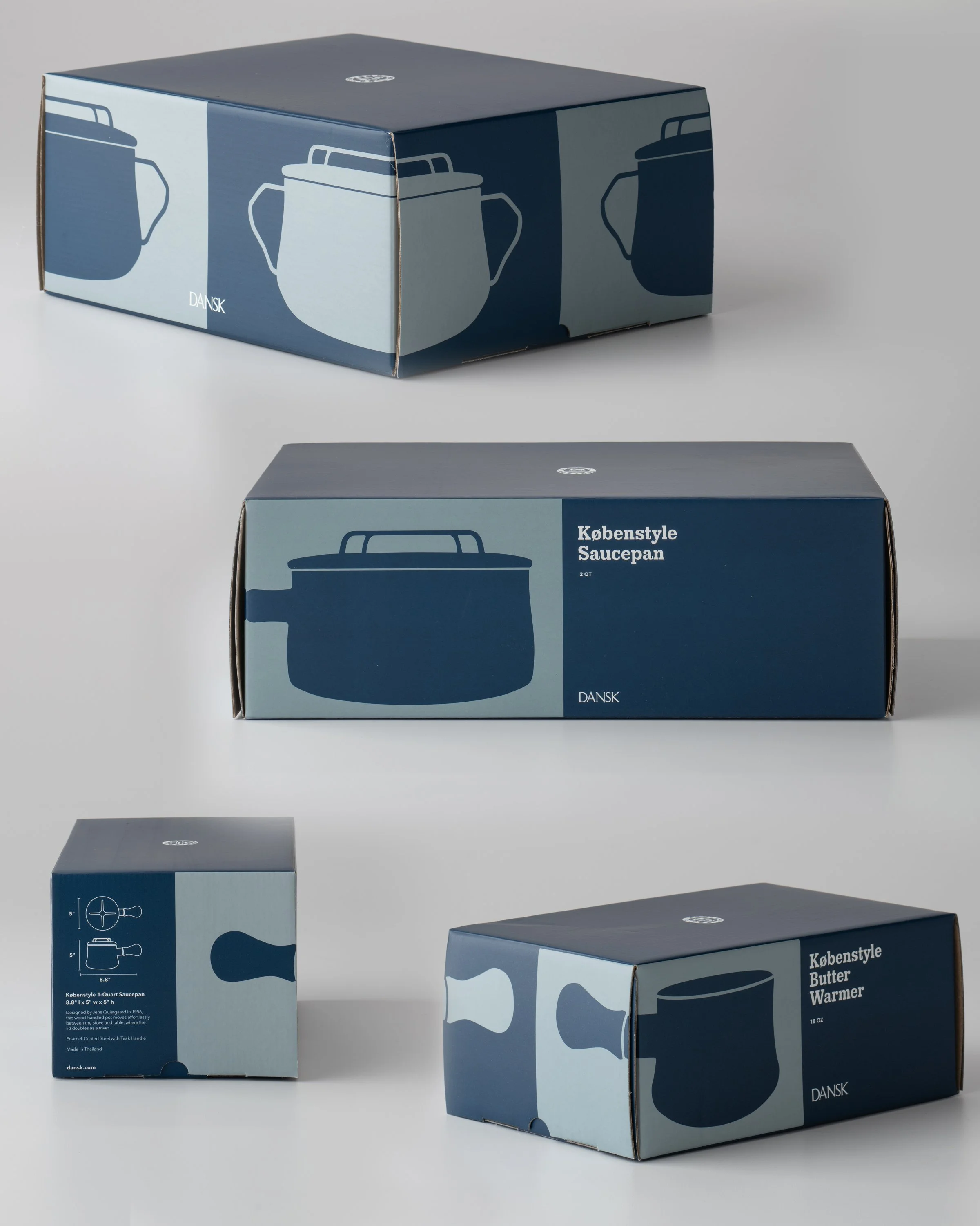 Arrangement of three boxes, each decorated with blue and light blue designs featuring pitchers, on a white surface against a plain light background.