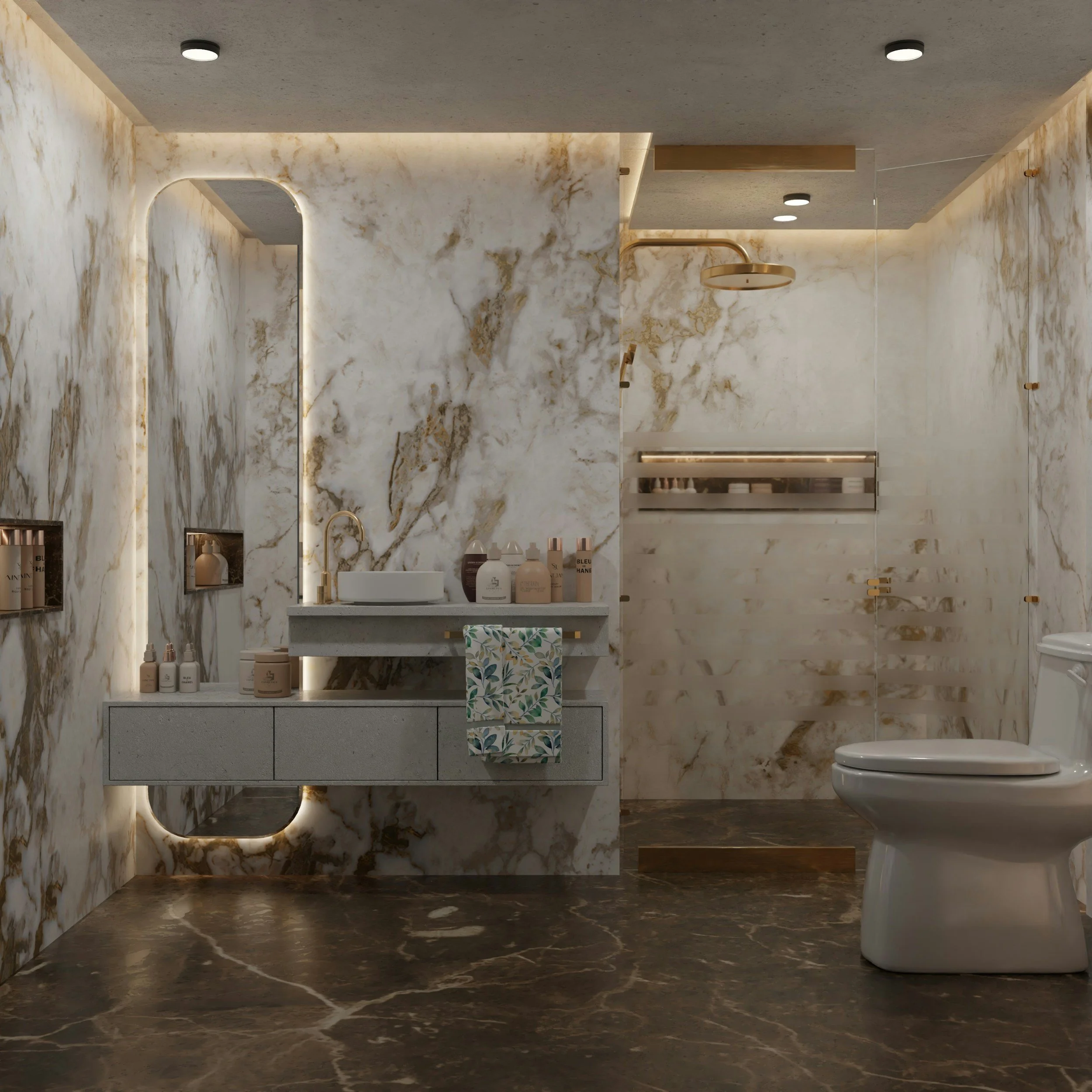 Modern bathroom featuring marble walls, a white sink, bottles of toiletries on the vanity, a toilet, and ceiling lights.