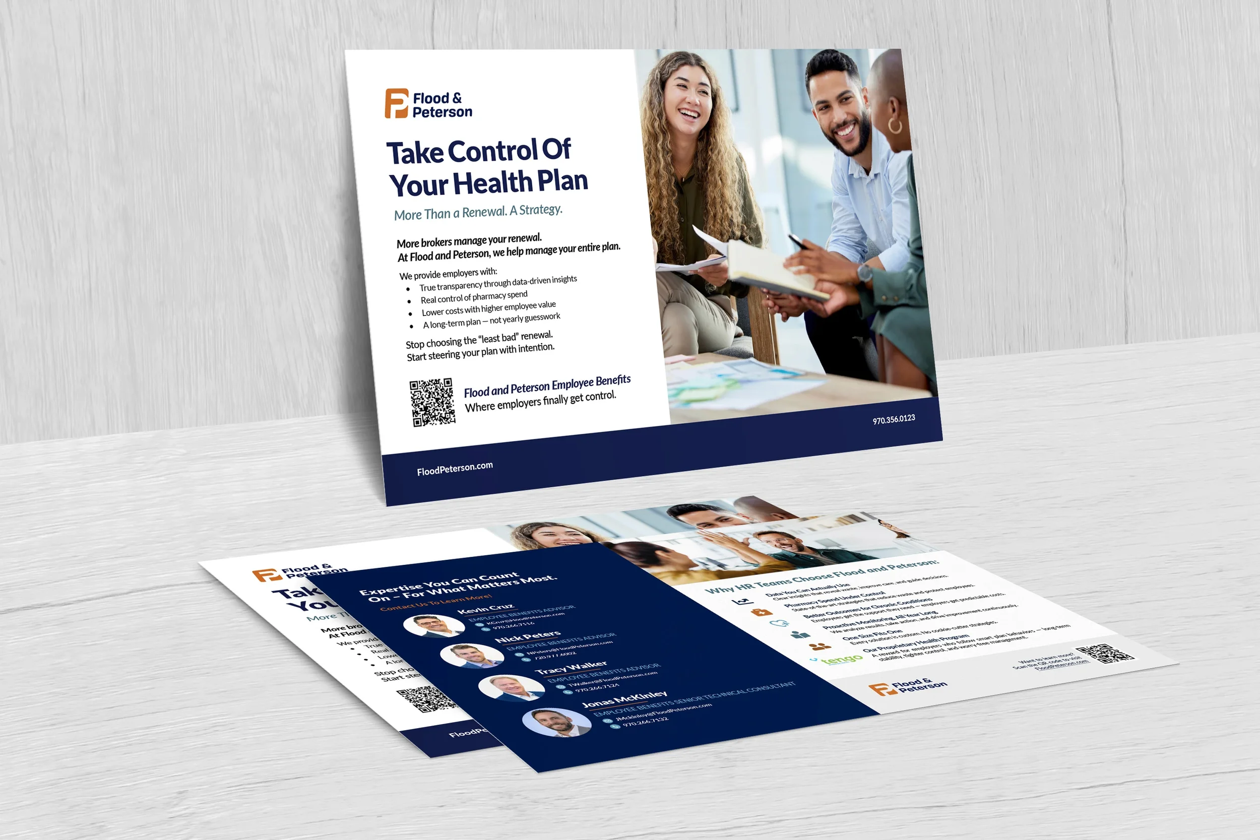 A printed flyer on a table promoting health plan management and employee benefits for Flood & Peterson, featuring a group discussion with diverse individuals in a modern office setting.