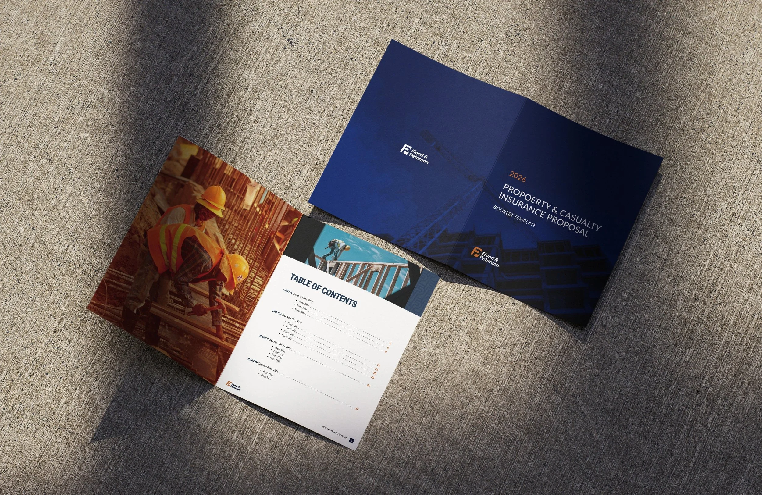 Brochure and booklet on a concrete surface, featuring construction workers and a tower crane.