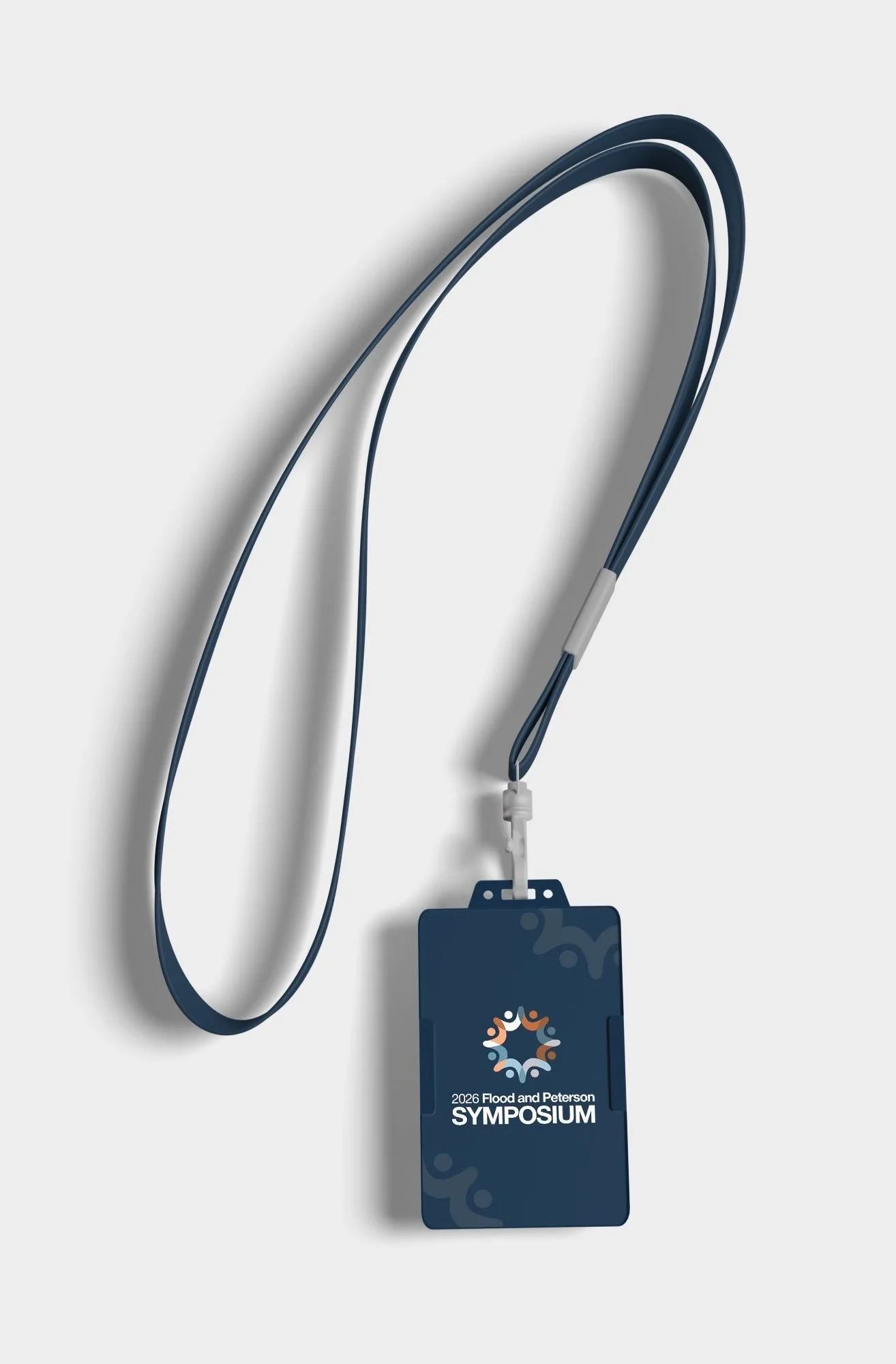 Lanyard with badge that reads '2026 Flood and Peterson Symposium' and a logo, attached to a phone or device.
