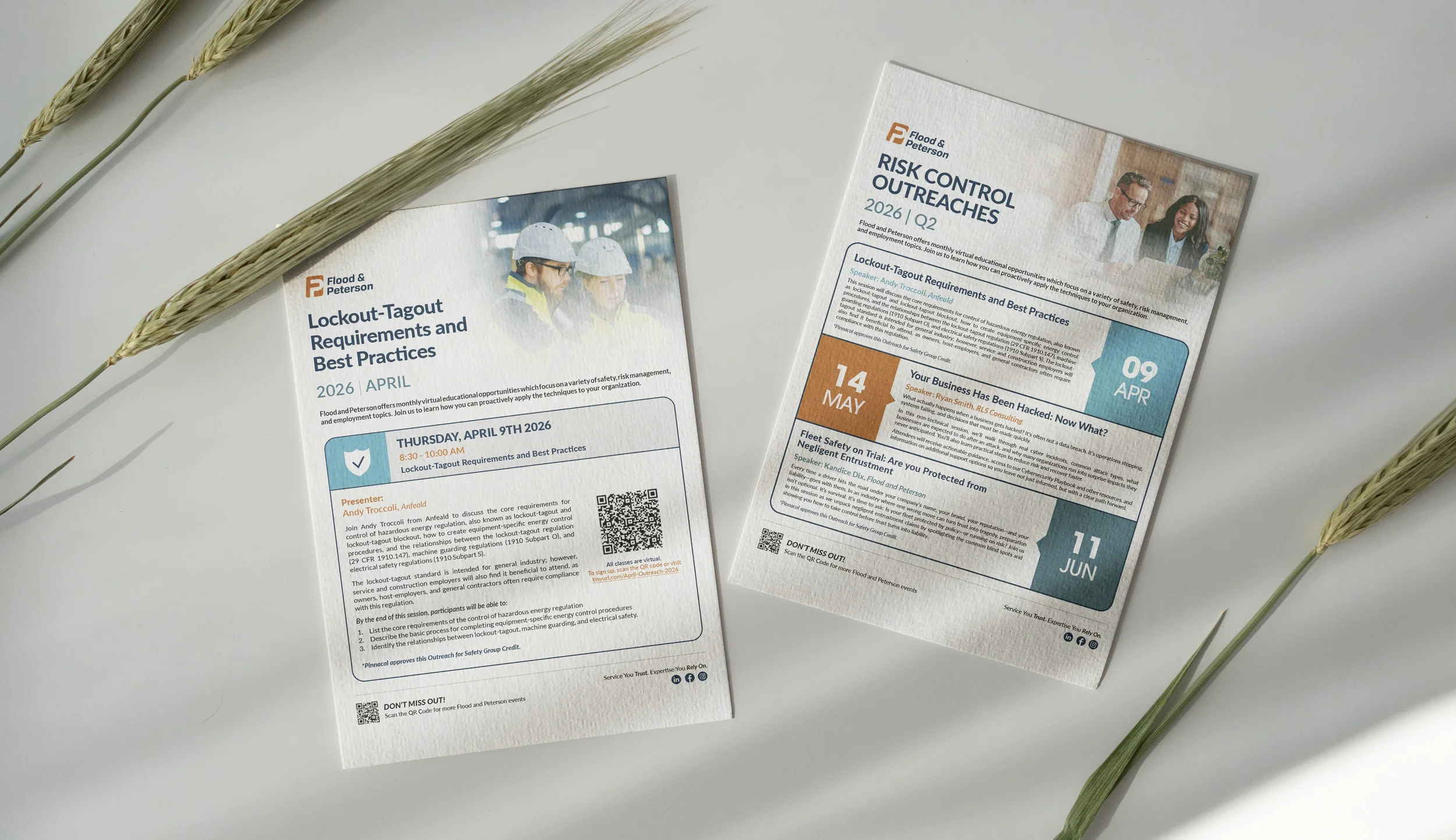 Two printed flyers about Lockout-Tagout requirements and best practices for safety regulations, one with a photo of two workers in safety helmets and another with a photo of two professionals smiling, placed on a white surface with some stalks of wheat nearby.