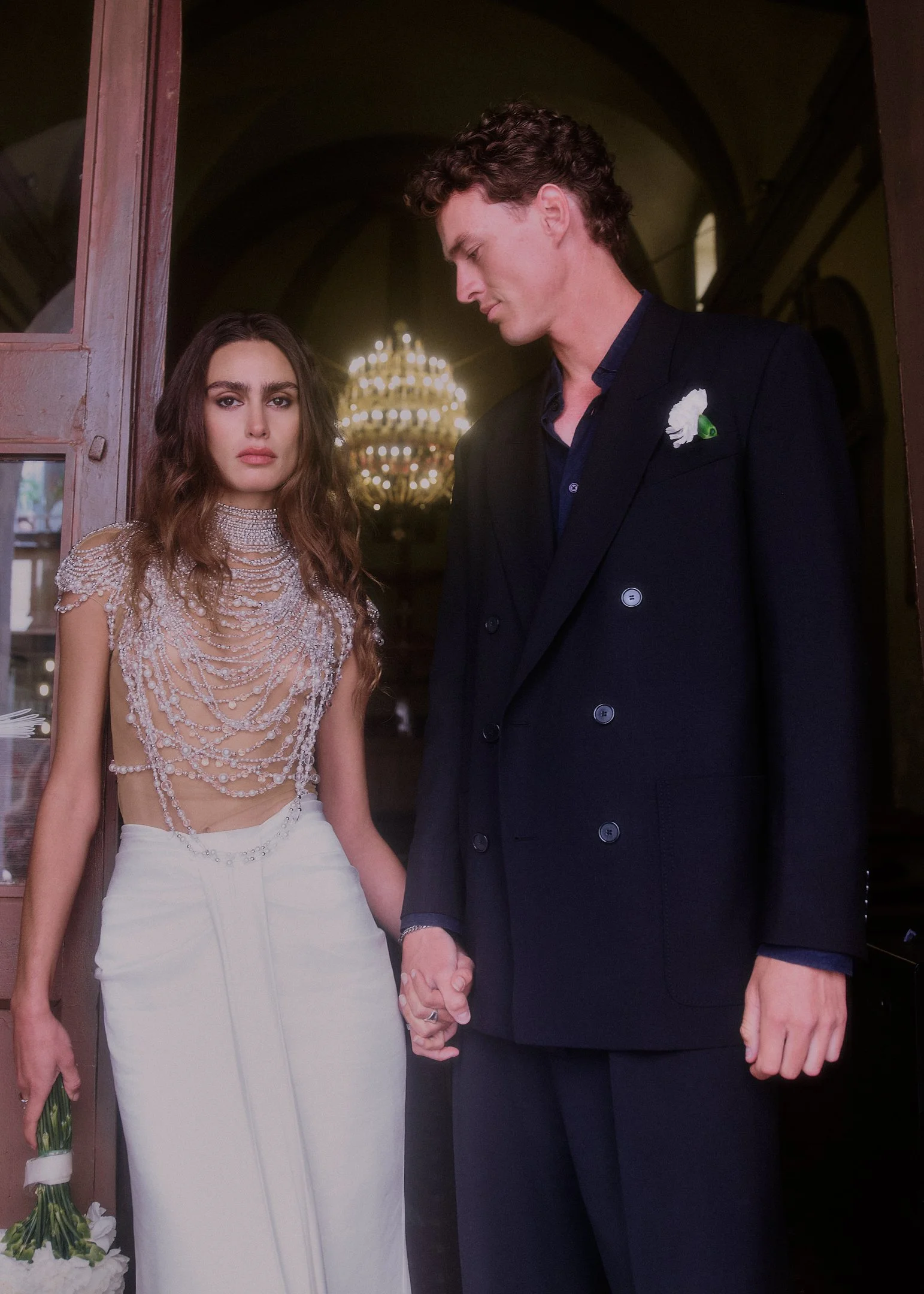 Elena and Oscar at the church door after the ceremony, destination wedding in a small town near Barcelona.