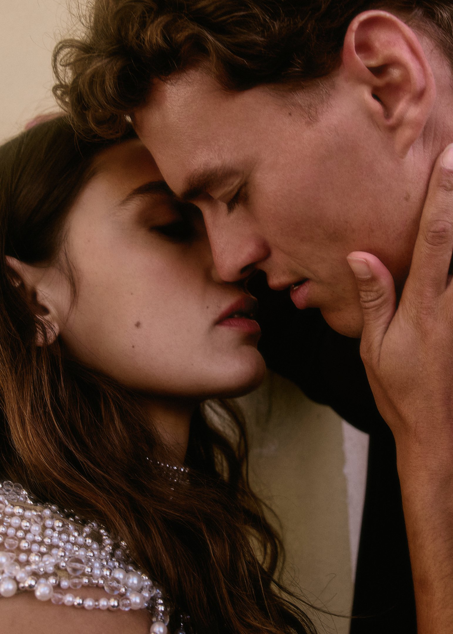 Intimate close-up of Elena and Oscar about to kiss, editorial wedding photography near Barcelona.
