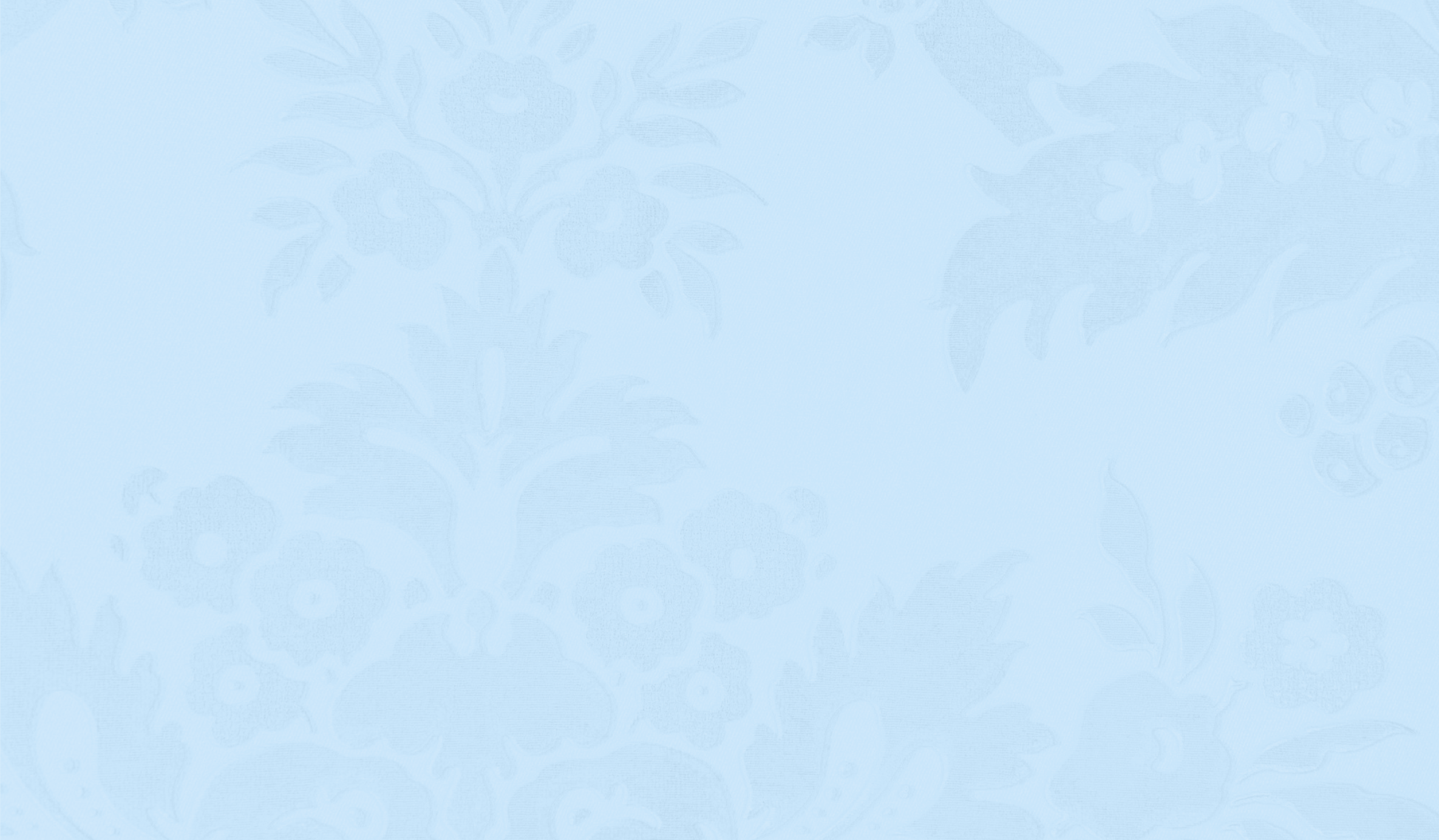 A light blue wallpaper with a subtle pattern of floral designs.