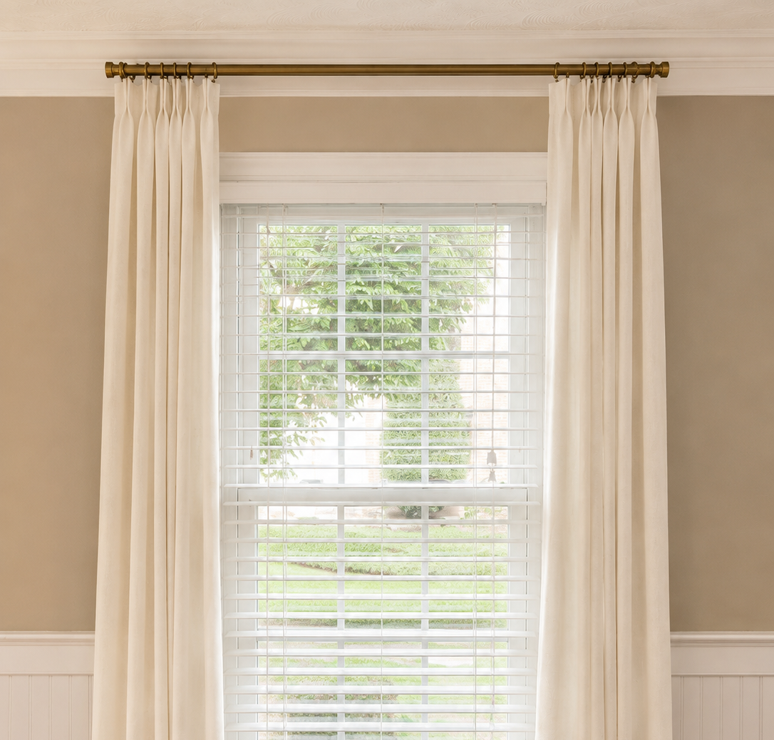Ivory Linen Drapes,
These ivory drapes soften the windows and add texture without taking attention away from the other details in the room. I especially love them against the deeper wall color.
Shop the drapes →