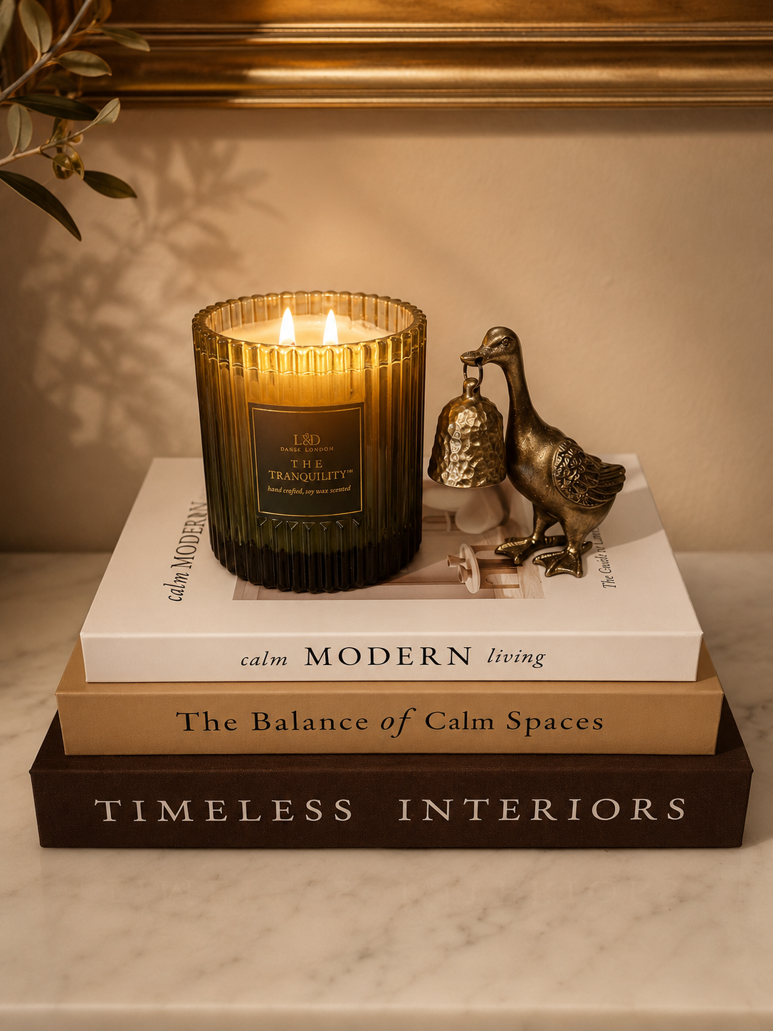 Silly Goose Candle Snuffer,
A whimsical little brass accent that brings personality to a stack of books or candle vignette.
Shop the candle snuffer →