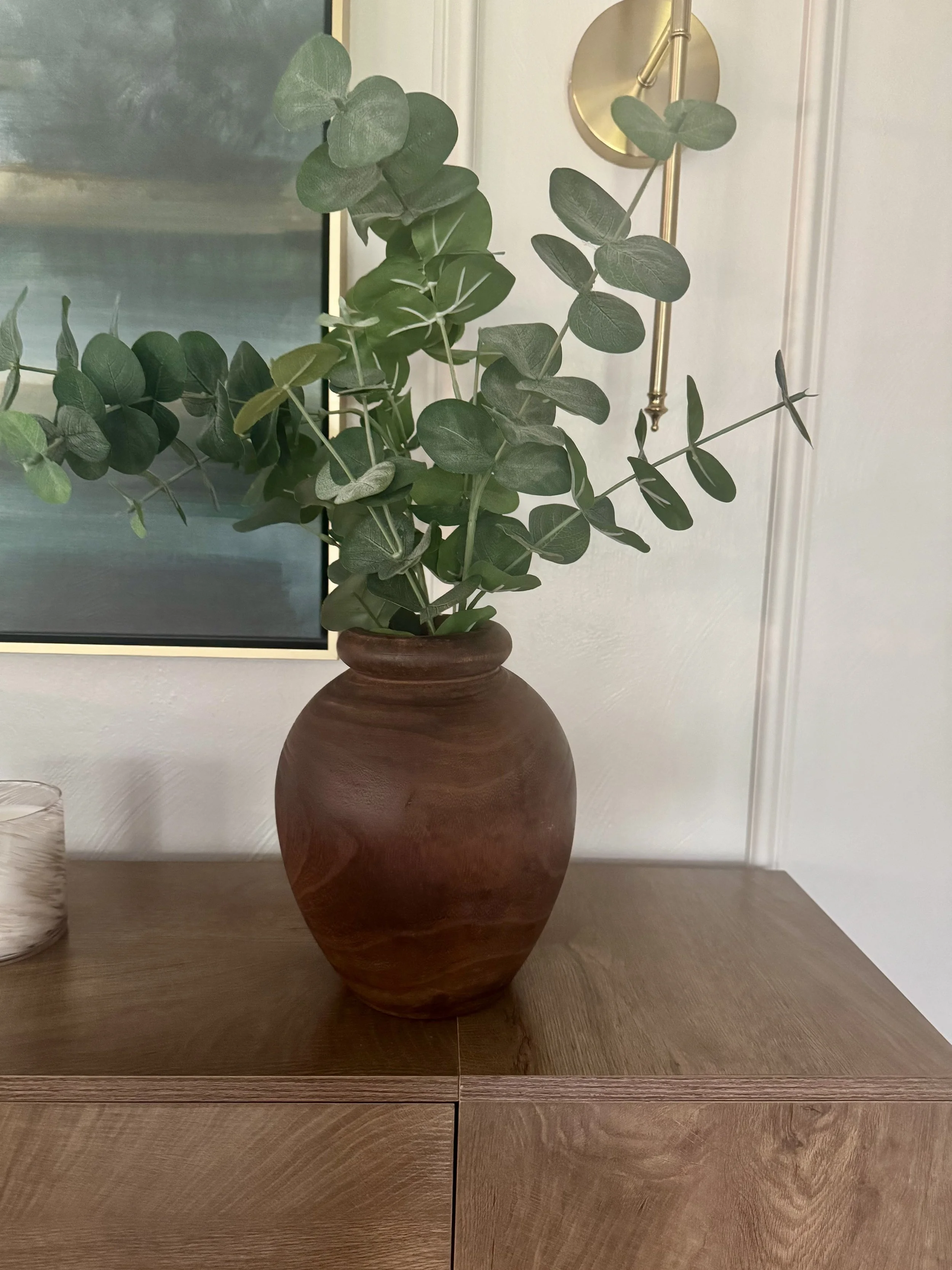 Eucalyptus Stems,
I love using greenery to bring a little life and color into a neutral room. These eucalyptus stems add height and softness without competing with the artwork.
Shop the eucalyptus stems →