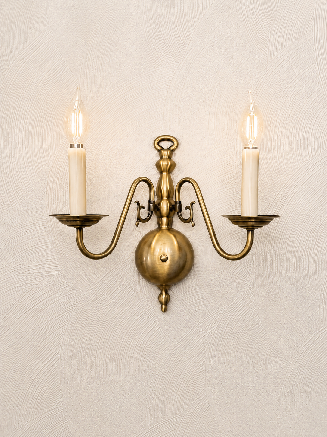 Williamsburg Two-Arm Wall Sconce,
I used these brass sconces to repeat the finish of the chandelier and add another layer of warm light around the room.
Shop the wall sconce →