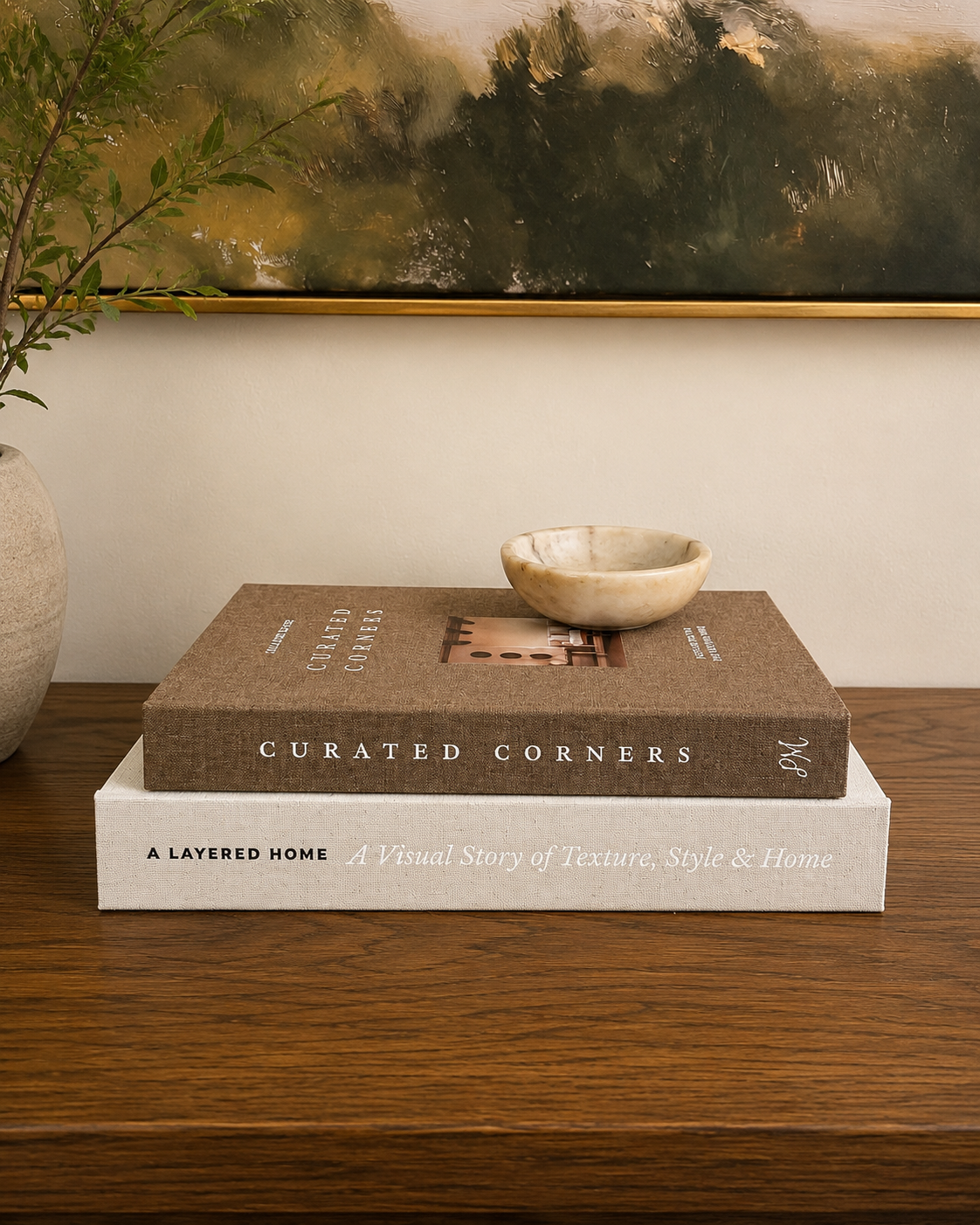 Decorative Book Stack,
I use books throughout our home to add height, texture, and another layer to a vignette. This neutral stack works beautifully with the warm, collected look of the dining room.
Shop the book stack →