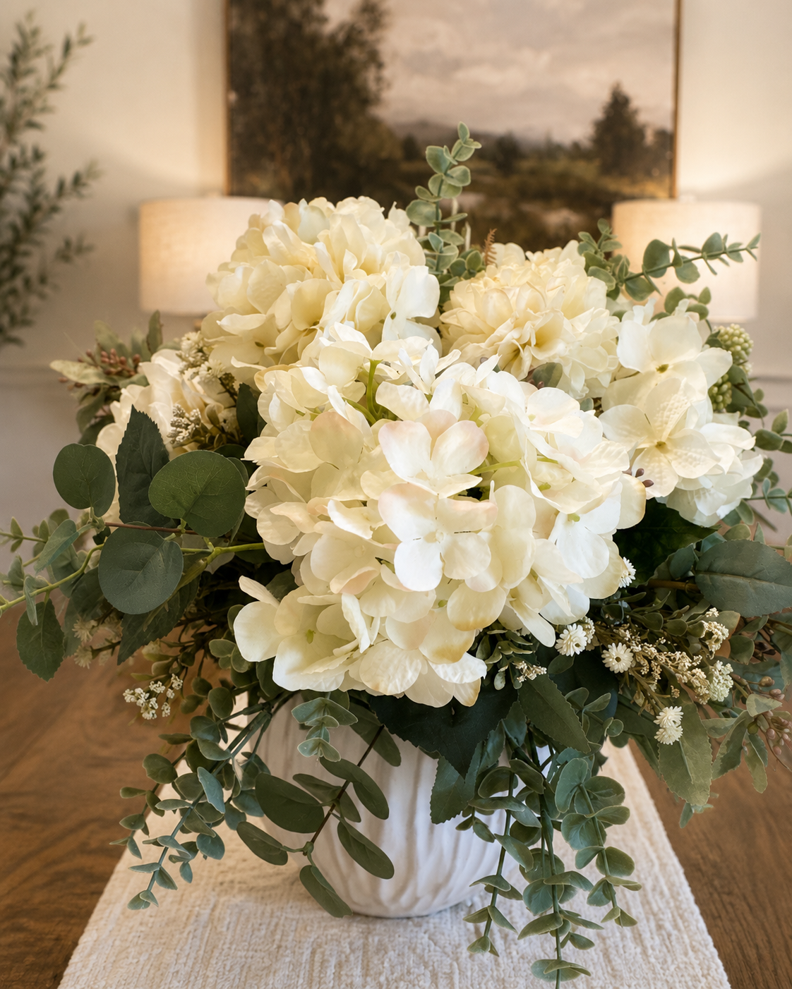 Faux Hydrangea Arrangement,
I love a full arrangement on our dining table, and these soft ivory hydrangeas bring in greenery and texture without adding too much color.
Shop the faux florals →