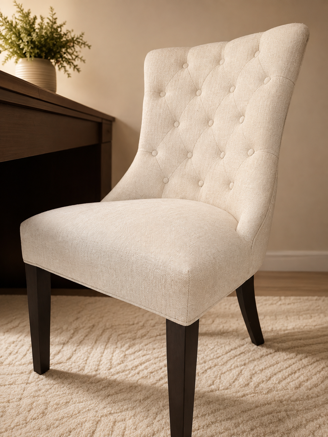 Upholstered Dining Chair,
The cream upholstery and dark wood legs bring softness and contrast to the office.
Shop the chair →