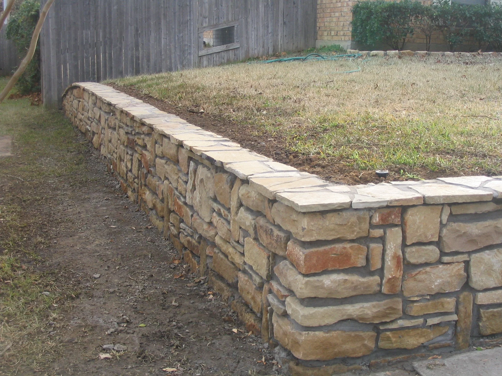 sandstone wall, random, gray joints, capped.JPG