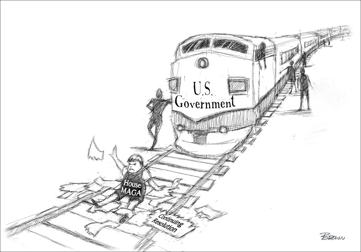 A political cartoon depicting a train labeled "U.S. Government" on a broken track. A figure labeled "House MAGA" is falling off the broken track, holding a flag and surrounded by papers labeled "Continuing Resolution". The cartoon shows a train about