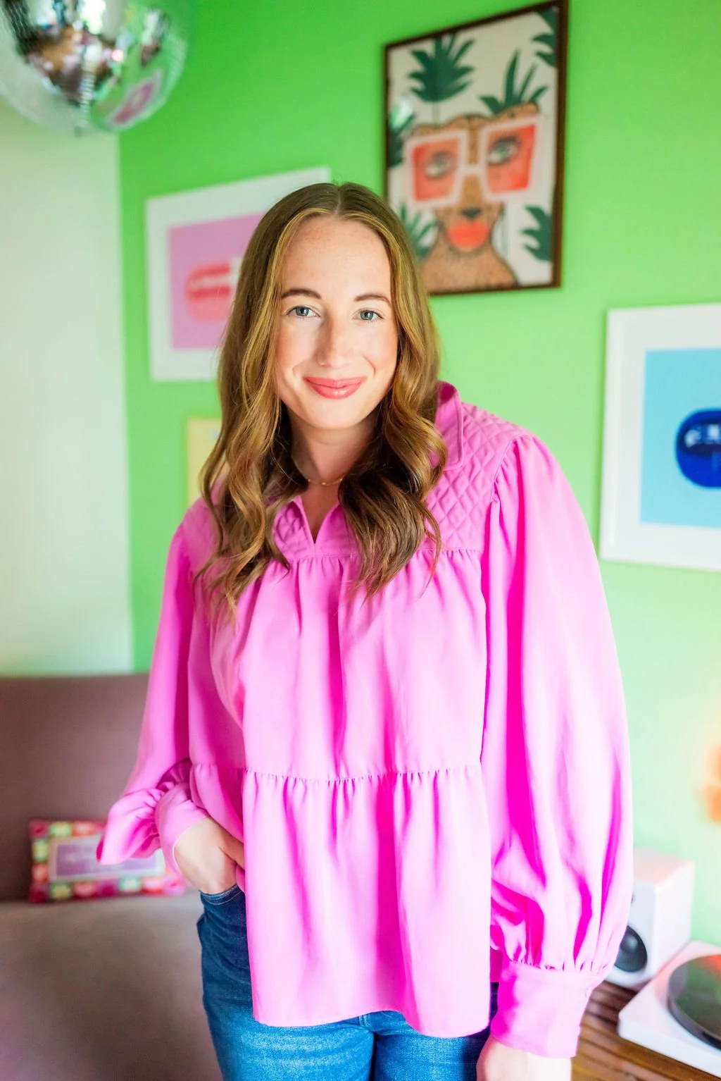 Licensed therapist and owner of Colorful Couch Counseling smiling in a welcoming therapy office.