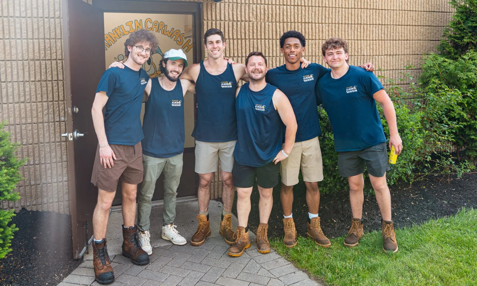 Franklin Car Wash team members outside the car wash in Franklin, Massachusetts