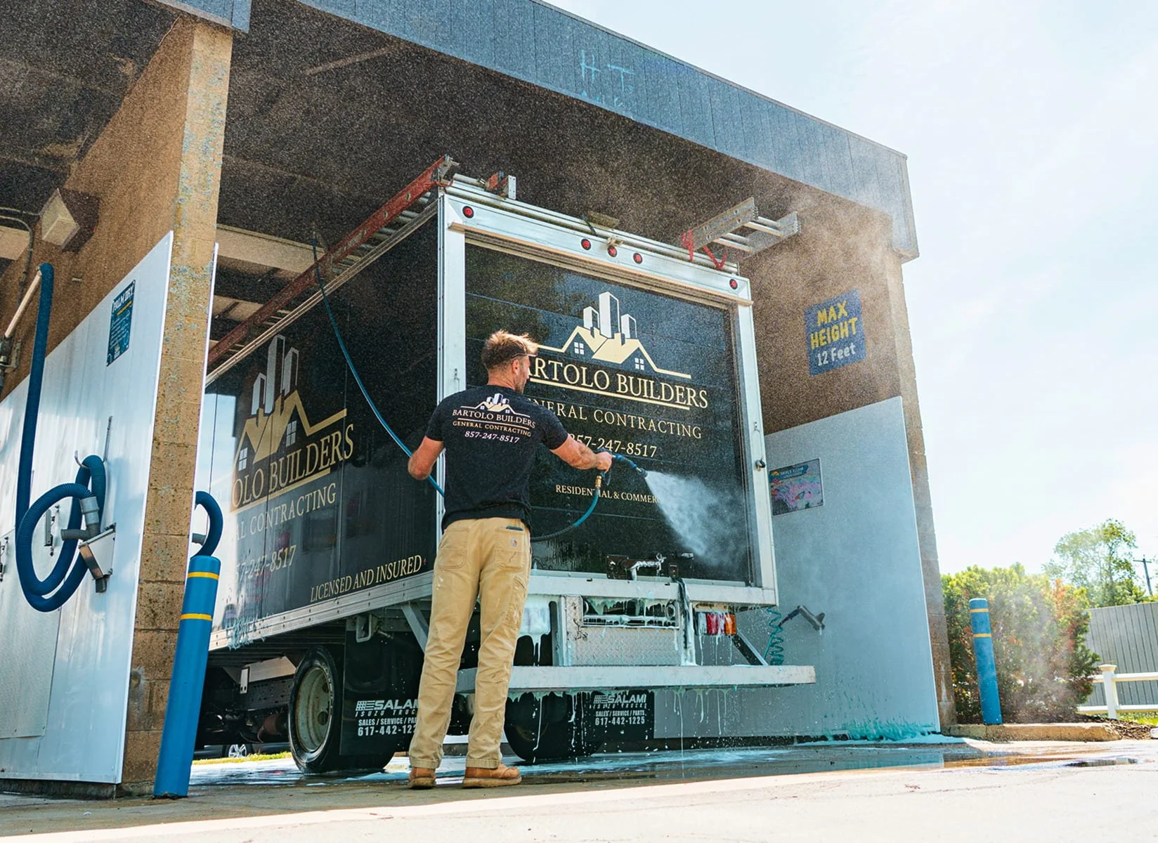 Customer using a self-service wash bay at The Franklin Car Wash