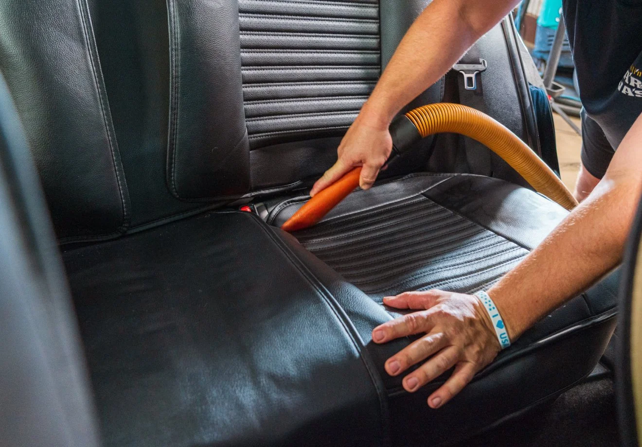 Interior car detailing and seat vacuuming at The Franklin Car Wash