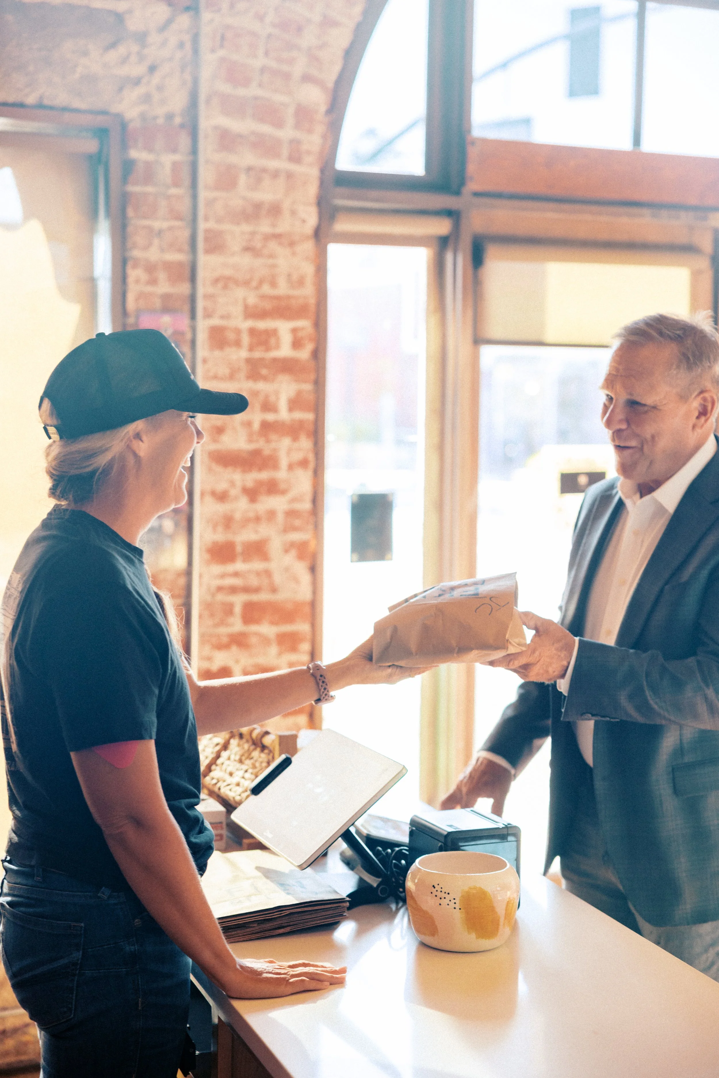 Jeff chatting with local business owner Bree of FKN Bread