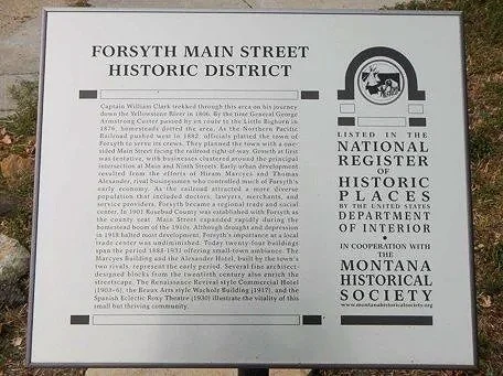Information board about Forsyth Main Street Historic District detailing its history, significance, and recognition, with Montana Historical Society logos. And the significance of 993 Main Street as the gateway to the Historical Downtown corridor.