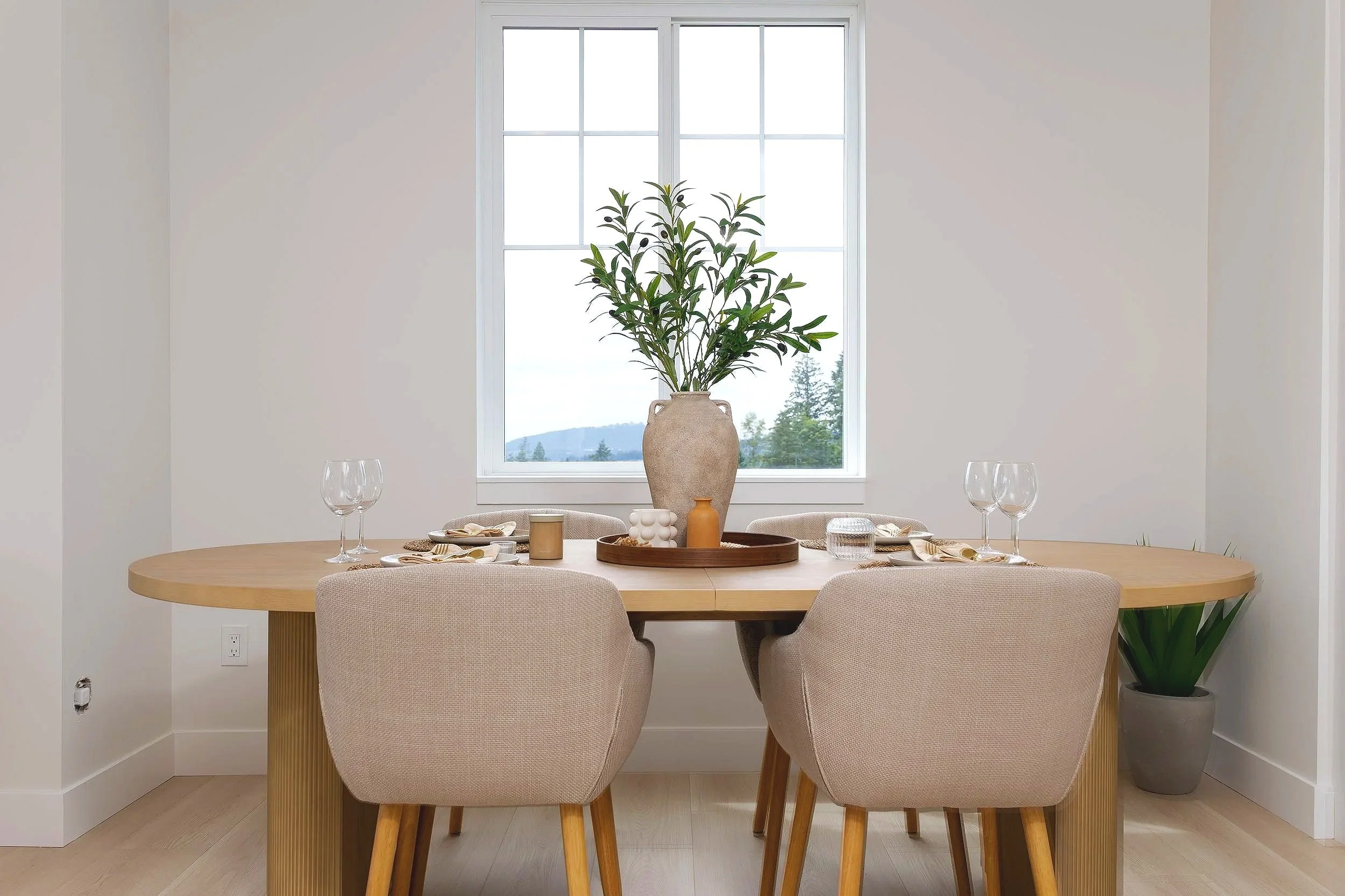 Dining area in a Clermont townhome featuring a modern table setting and open-concept living space.