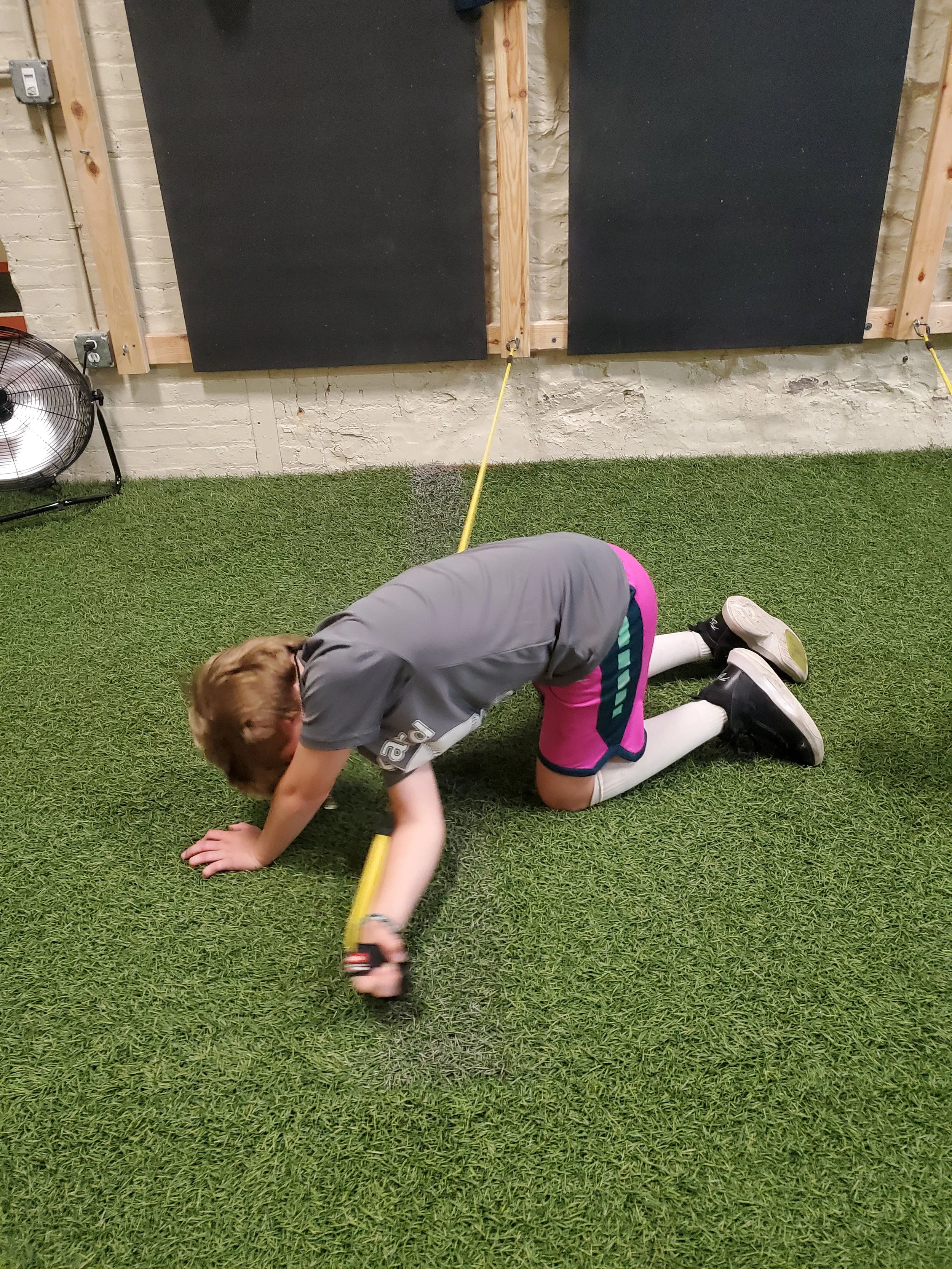 A young baseball player doing a pitching workout.