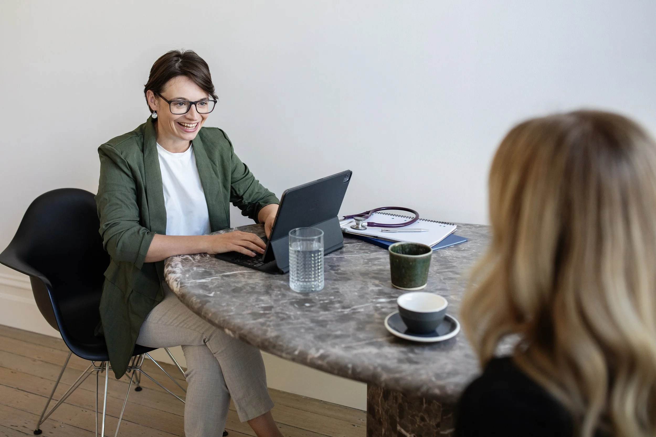 A veterinary oncologist listening to her client to create an individualised care plan to meet the family’s goals.
