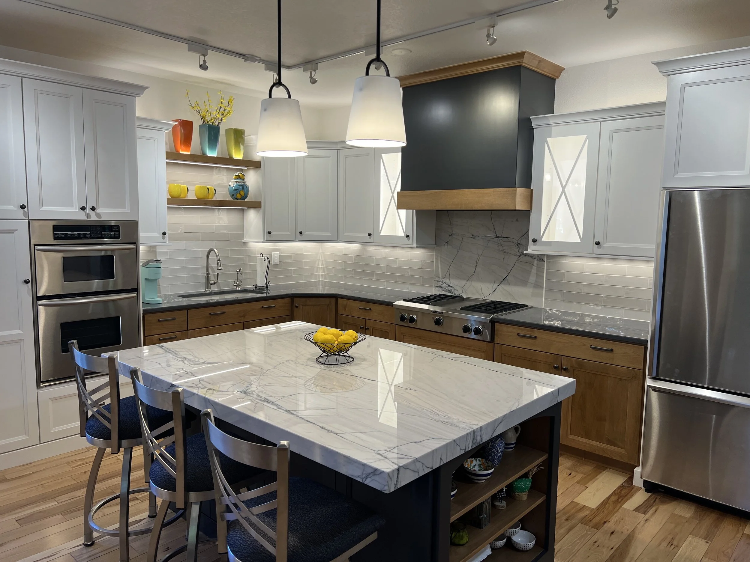 Remodeled kitchen lighting with new pendant lights, LED under cabinet lighting, LED shelf up and down lighting and plug mold receptacles in Fort Collins, Colorado