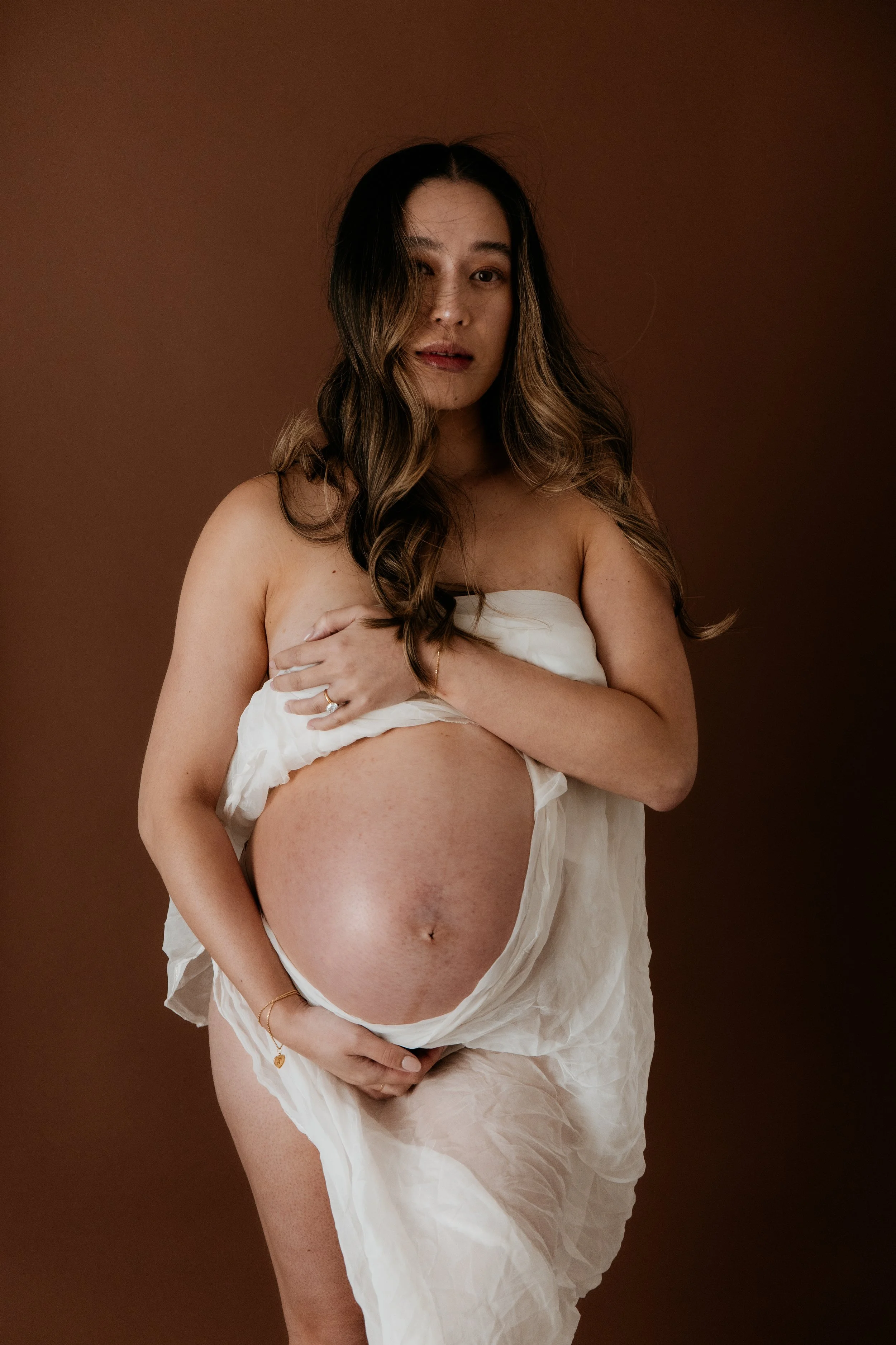 Luxury maternity photography in Melbourne capturing an expectant mother in an elegant editorial pregnancy portrait.
