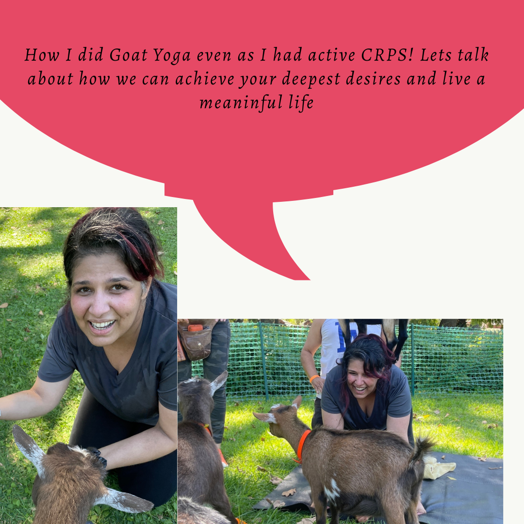 A woman with dark hair and a dark shirt, interacting with baby goats outdoors on grass, smiling and petting them during a goat yoga session.
