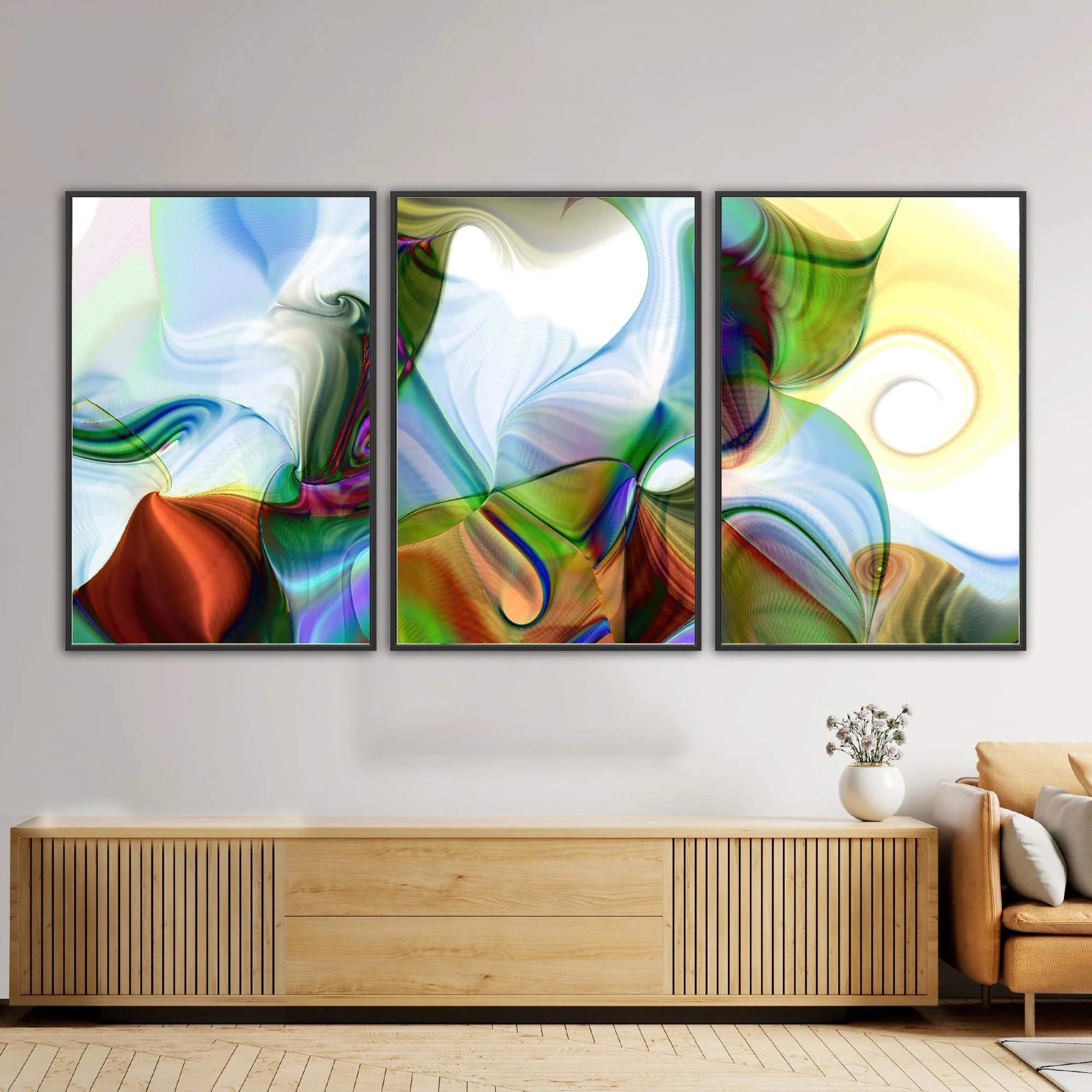 Abstract triptych with spiral patterns, line textures, and a color palette of forest green, sky blue, and warm earth tones over a white background, framed and ready to hang. Over wooden console