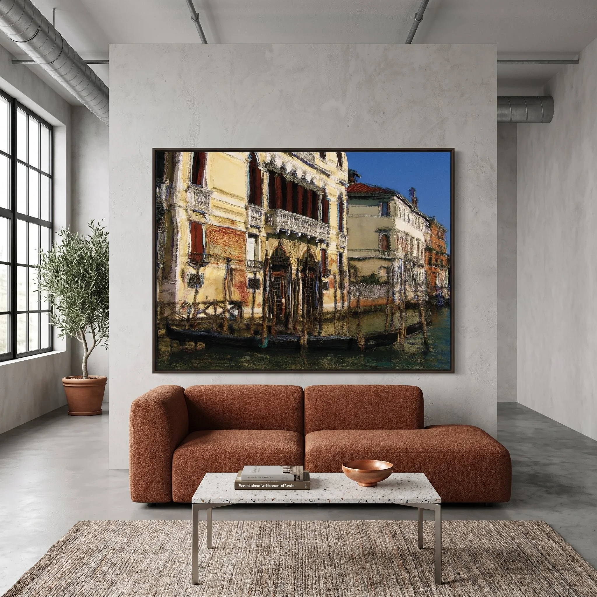 Large-format Venice fine art print hanging on a light concrete wall of a modern loft living room with a terracotta sofa, terrazzo coffee table, and indoor potted tree
