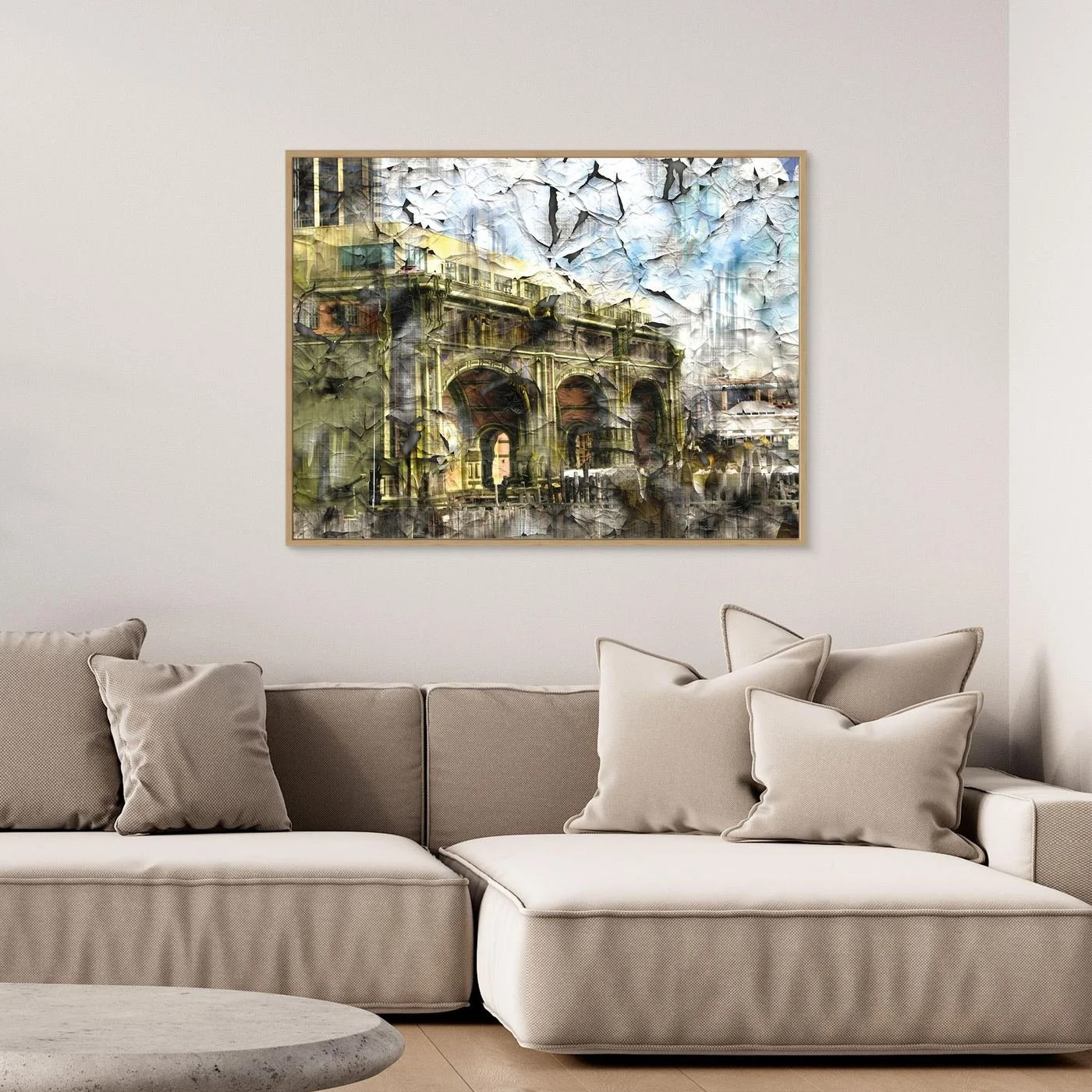 Abstract fine art print showcasing classical building arches with heavy cracked and distressed paint textures in gold, grey, and soft blue tones, framed and ready to hang. Over grey couch