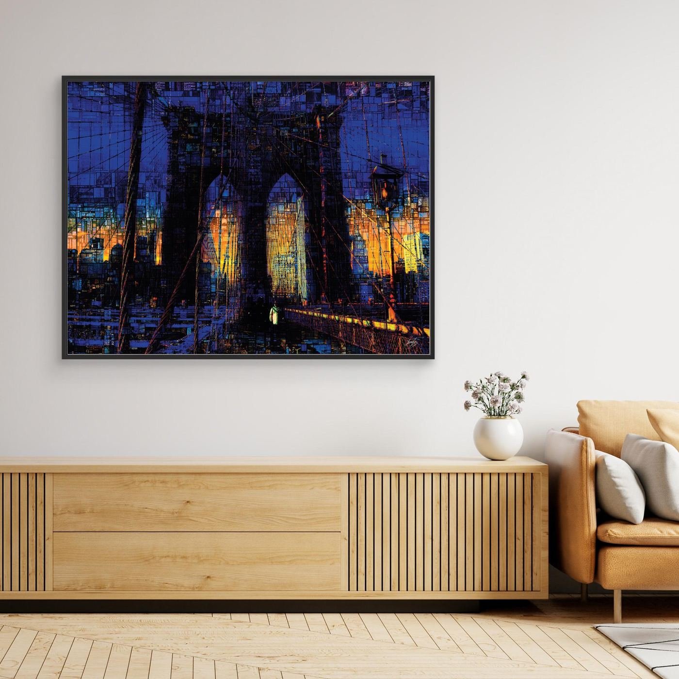 Abstract fine art print of the Brooklyn Bridge at sunset featuring a complex mosaic and pixelated texture in deep blue and vibrant golden tones, framed and ready to hang. Over wooden console