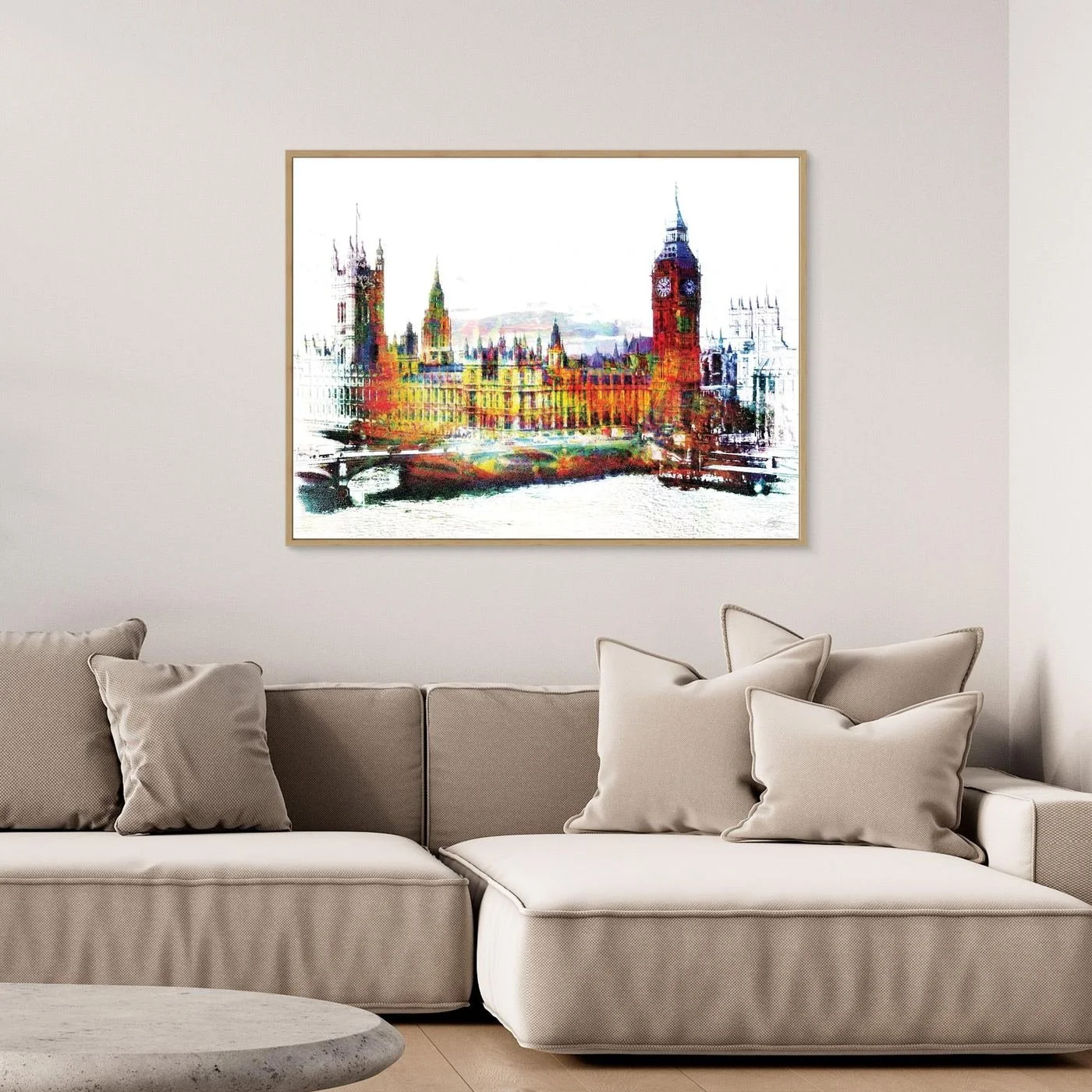 Expressionist fine art print of London's Houses of Parliament and Big Ben featuring high-contrast multicolor textures on a bright white background, framed and ready to hang. Over grey couch